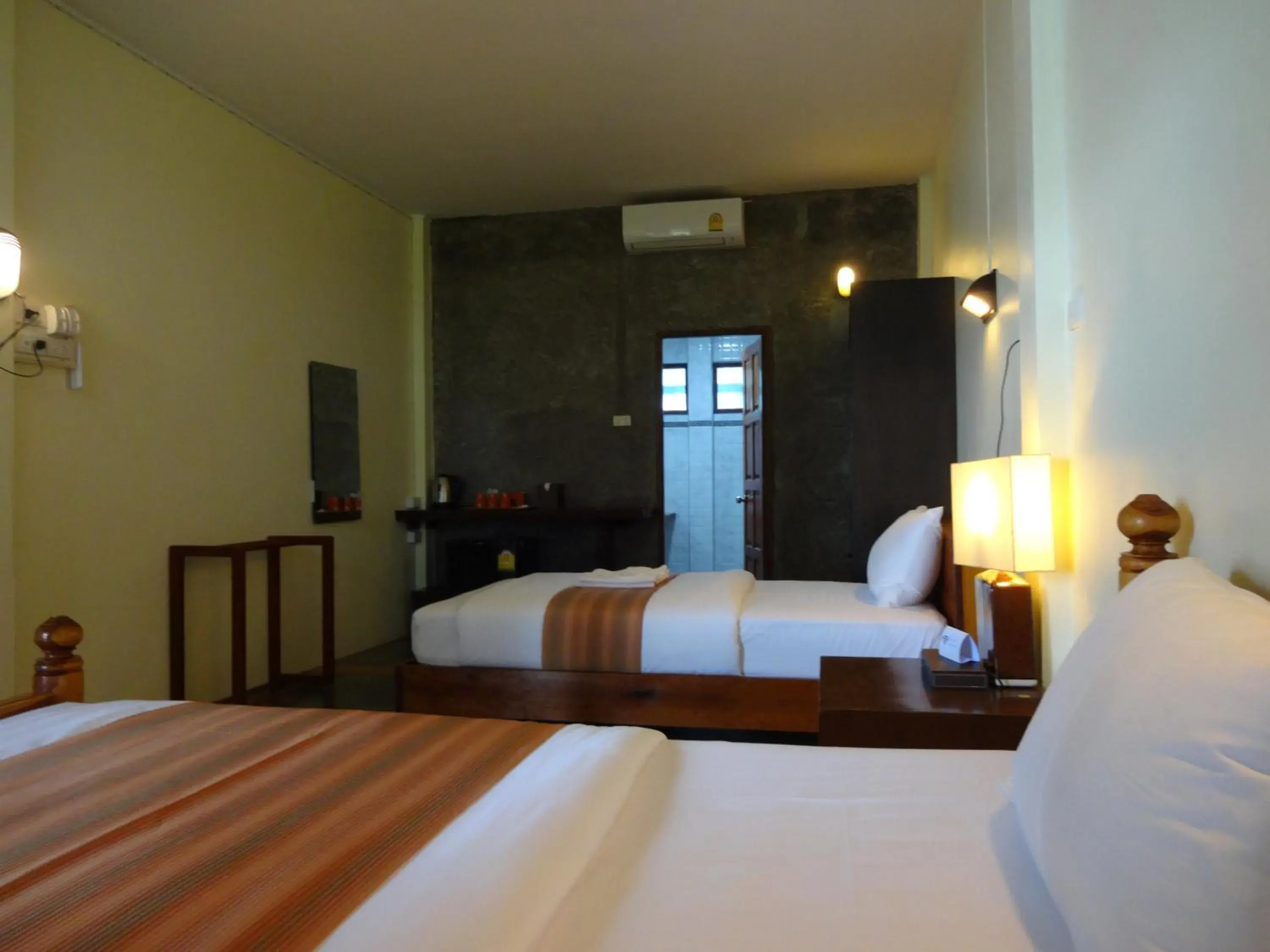 Bed in The Chevalley Beach Resort Bed in The Chevalley Beach Resort