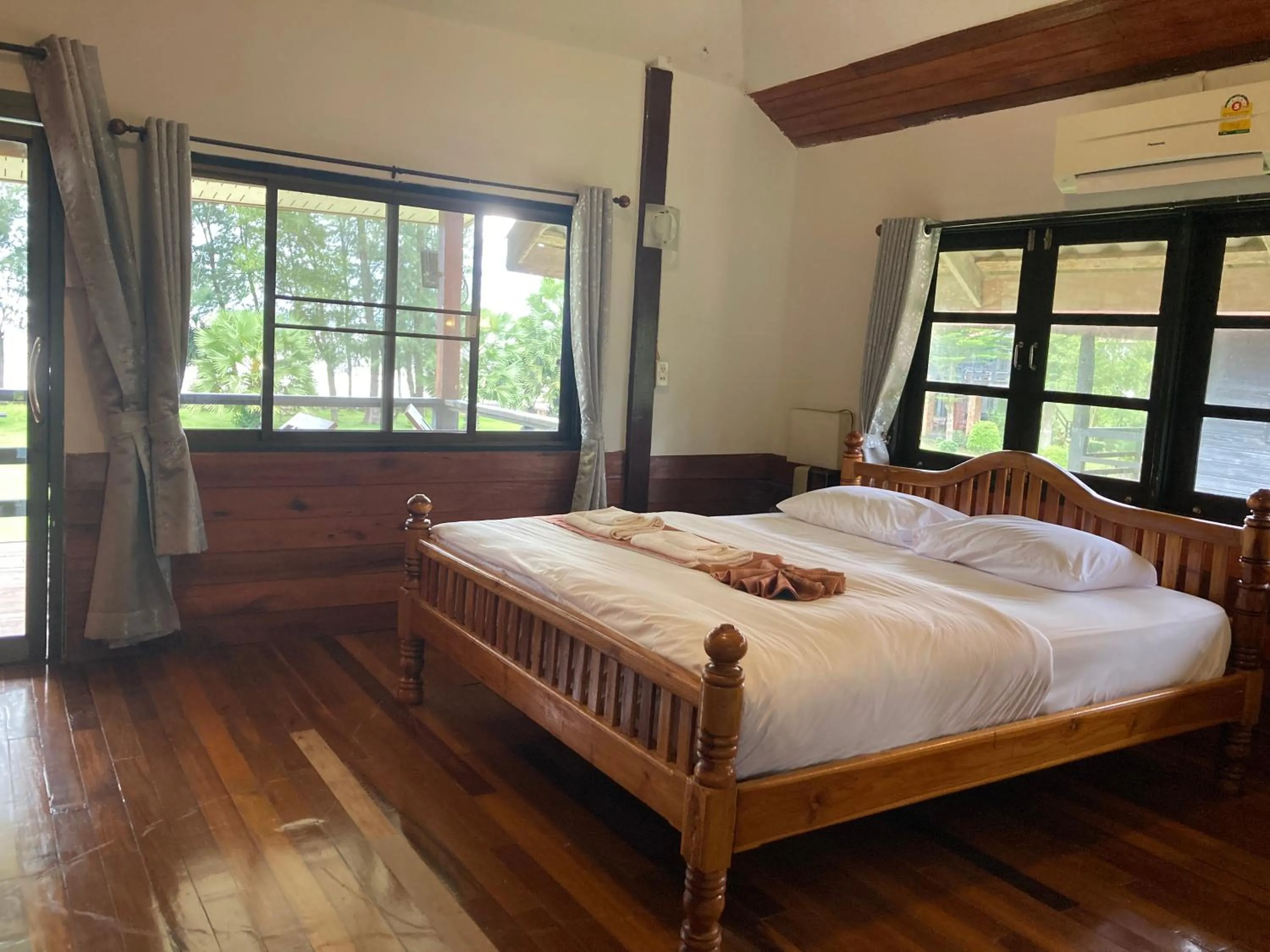 Bed in The Chevalley Beach Resort