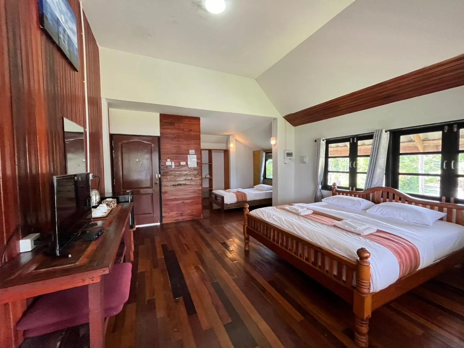 Bed in The Chevalley Beach Resort