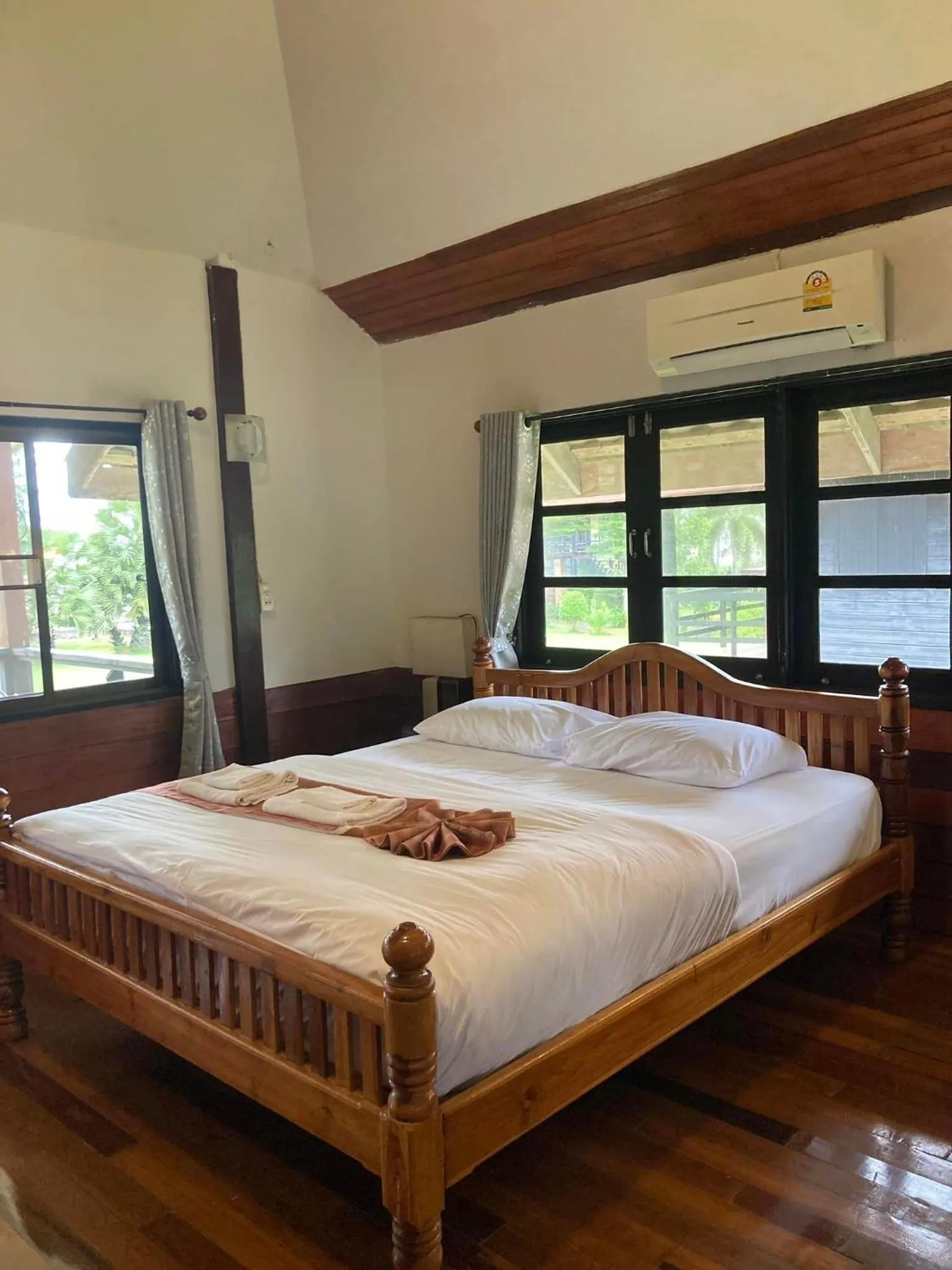 Bed in The Chevalley Beach Resort