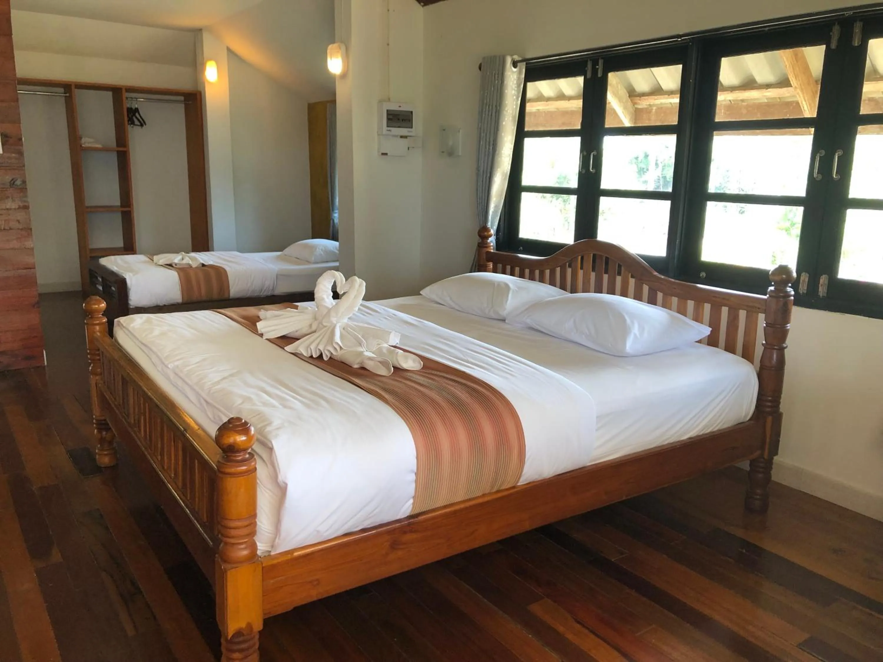 Bed in The Chevalley Beach Resort