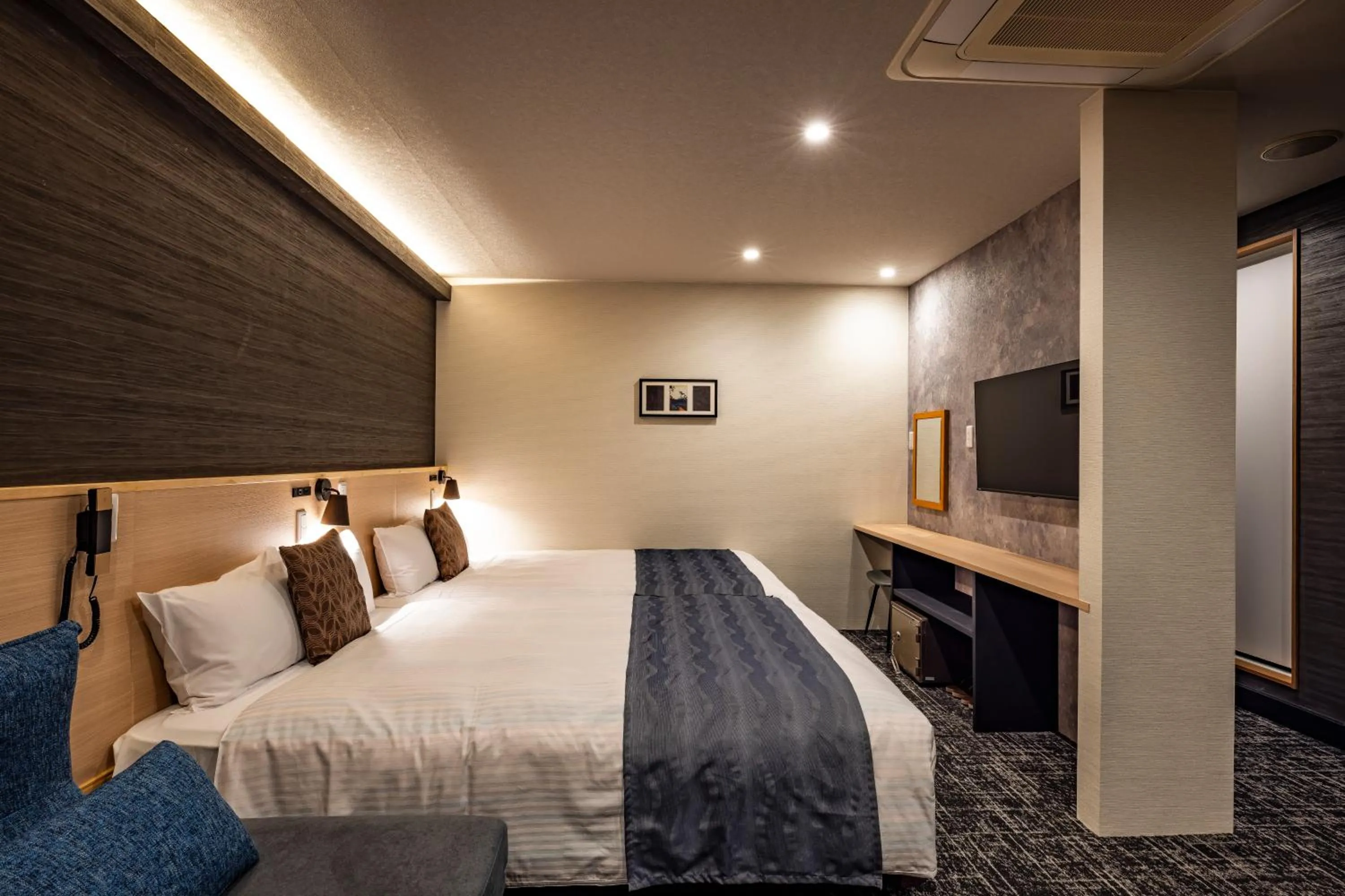 Bed in Hotel Quest Shimizu