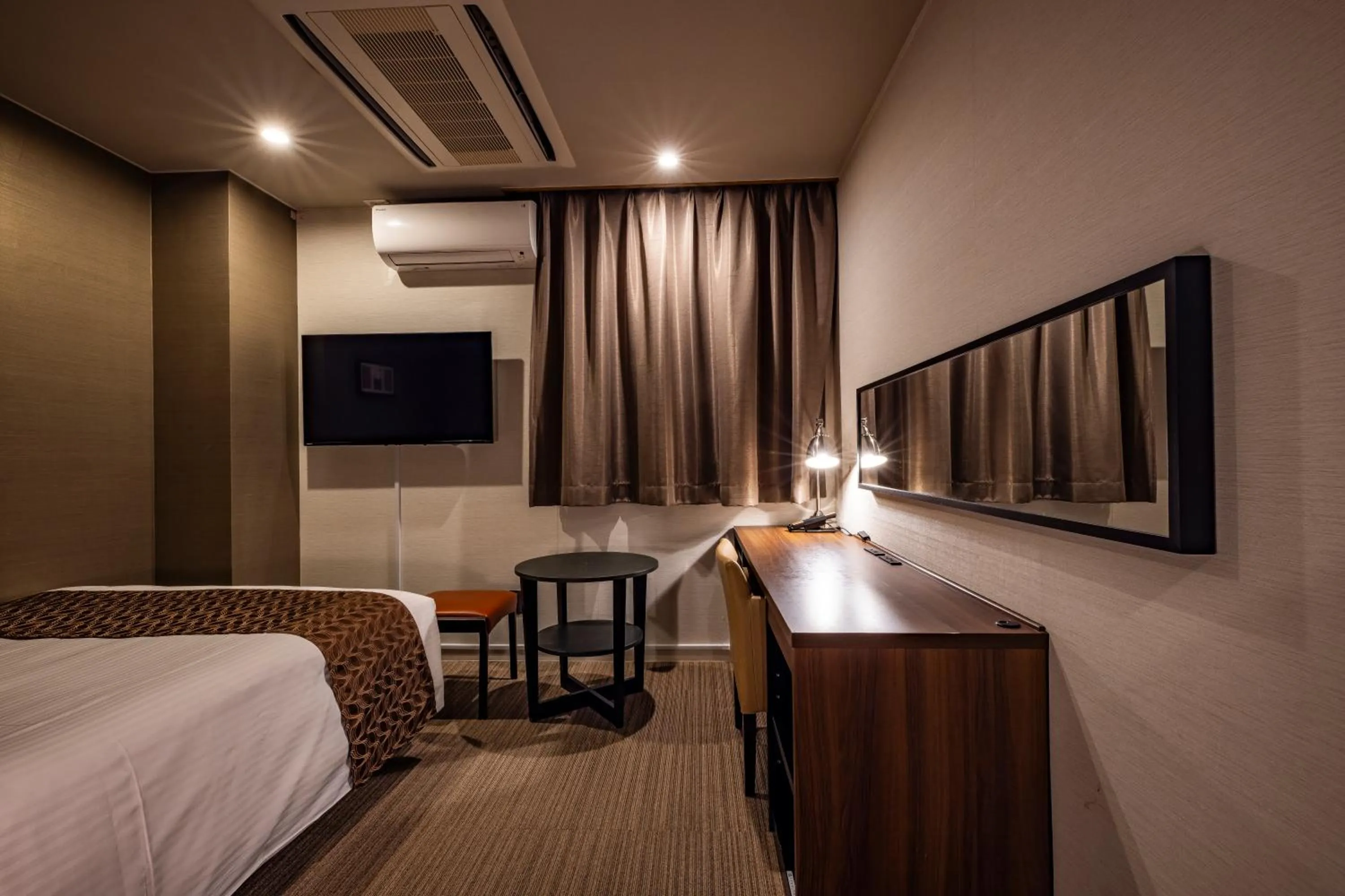 Bed in Hotel Quest Shimizu