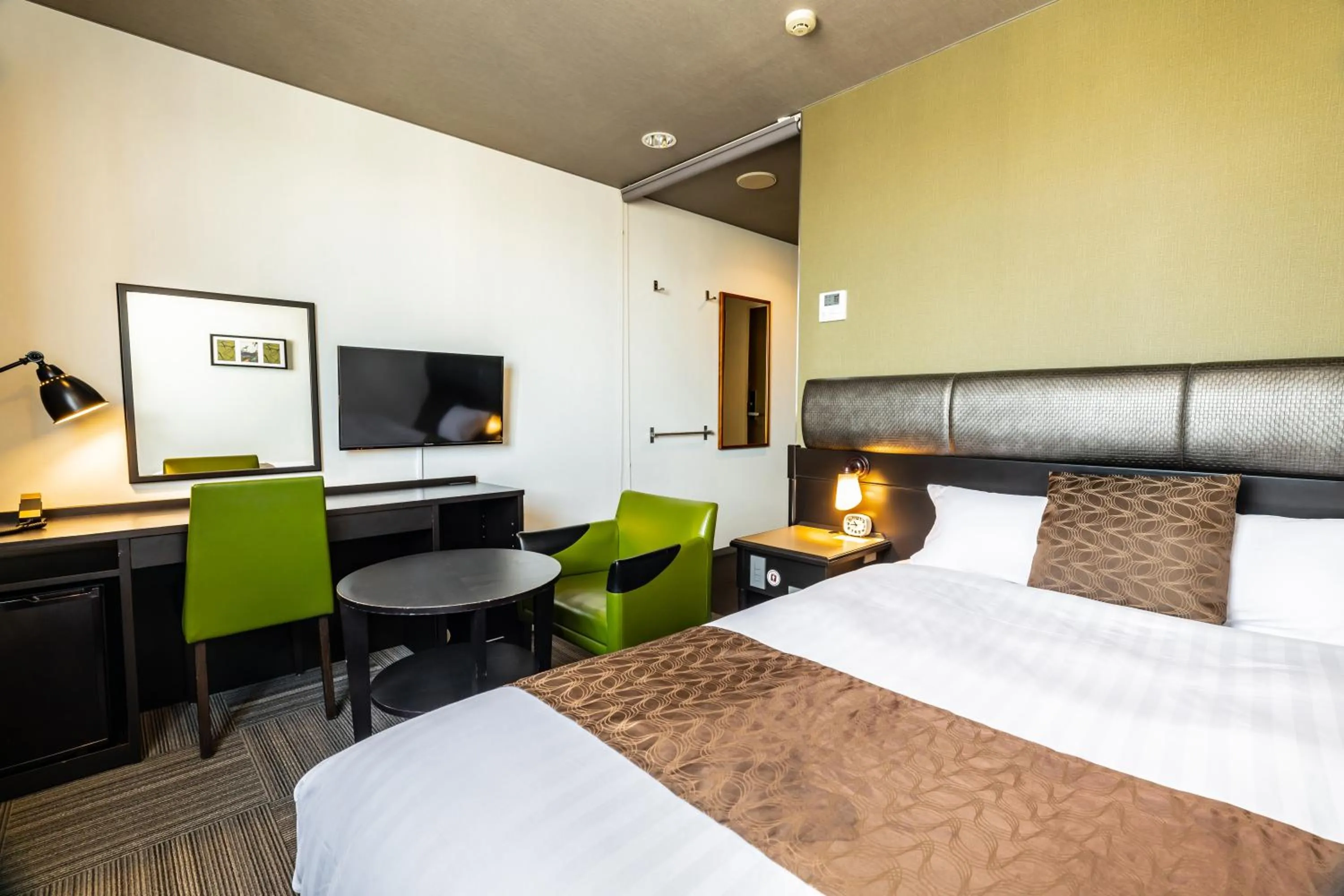 Bed in Hotel Quest Shimizu