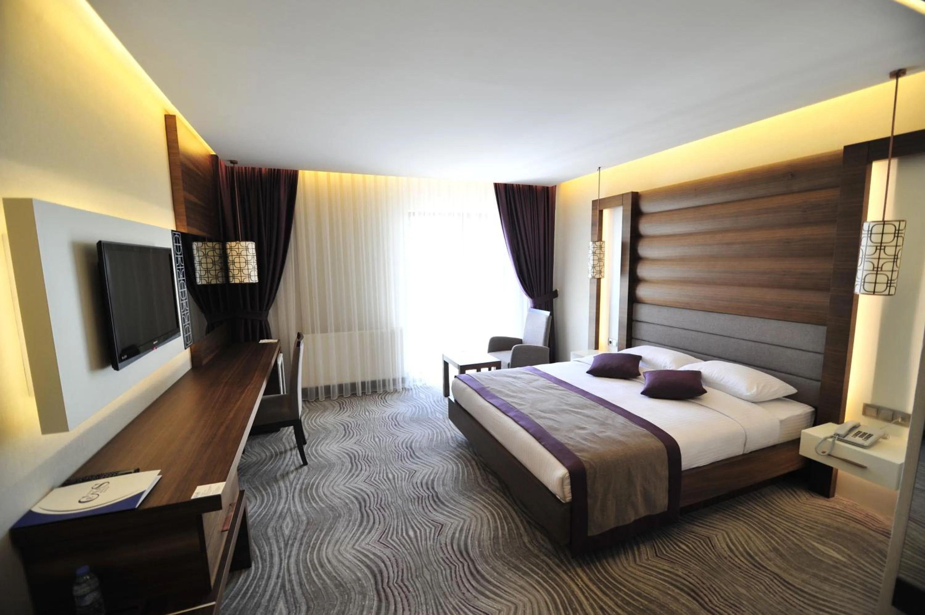 Bed in Grand Cenas Hotel