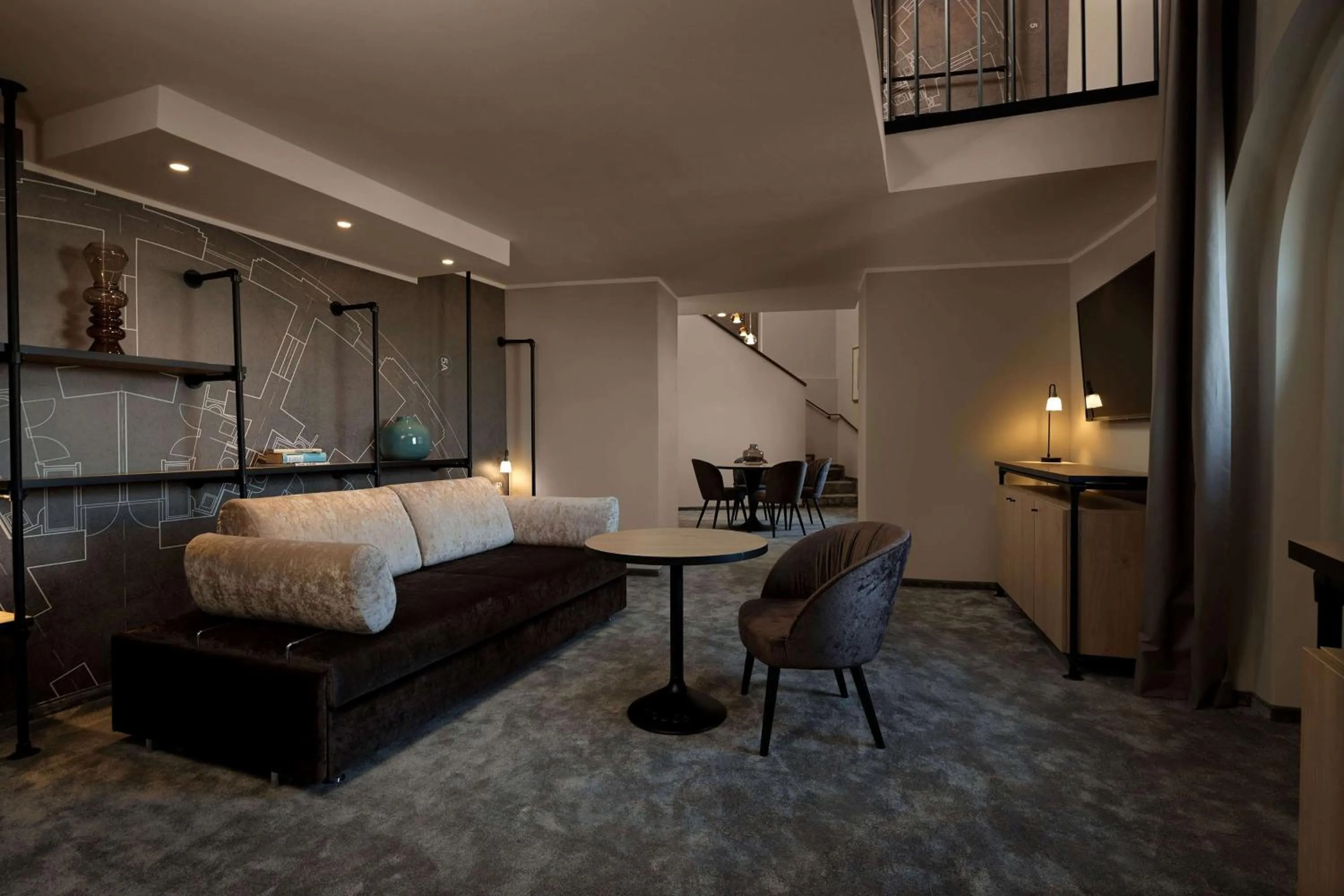 Living room, Bed in Wasserturm Hotel Cologne, Curio Collection by Hilton