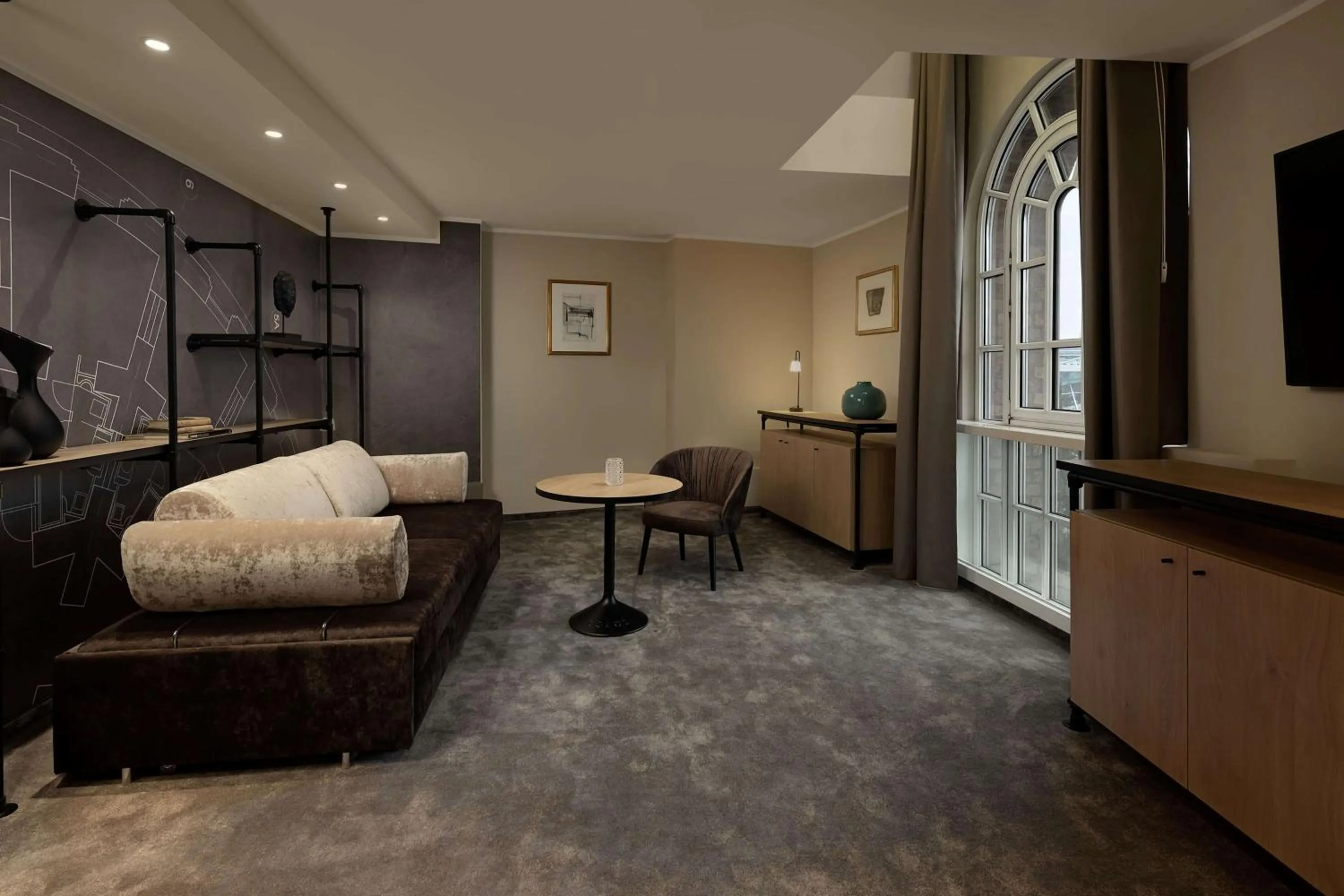 Living room, Bed in Wasserturm Hotel Cologne, Curio Collection by Hilton