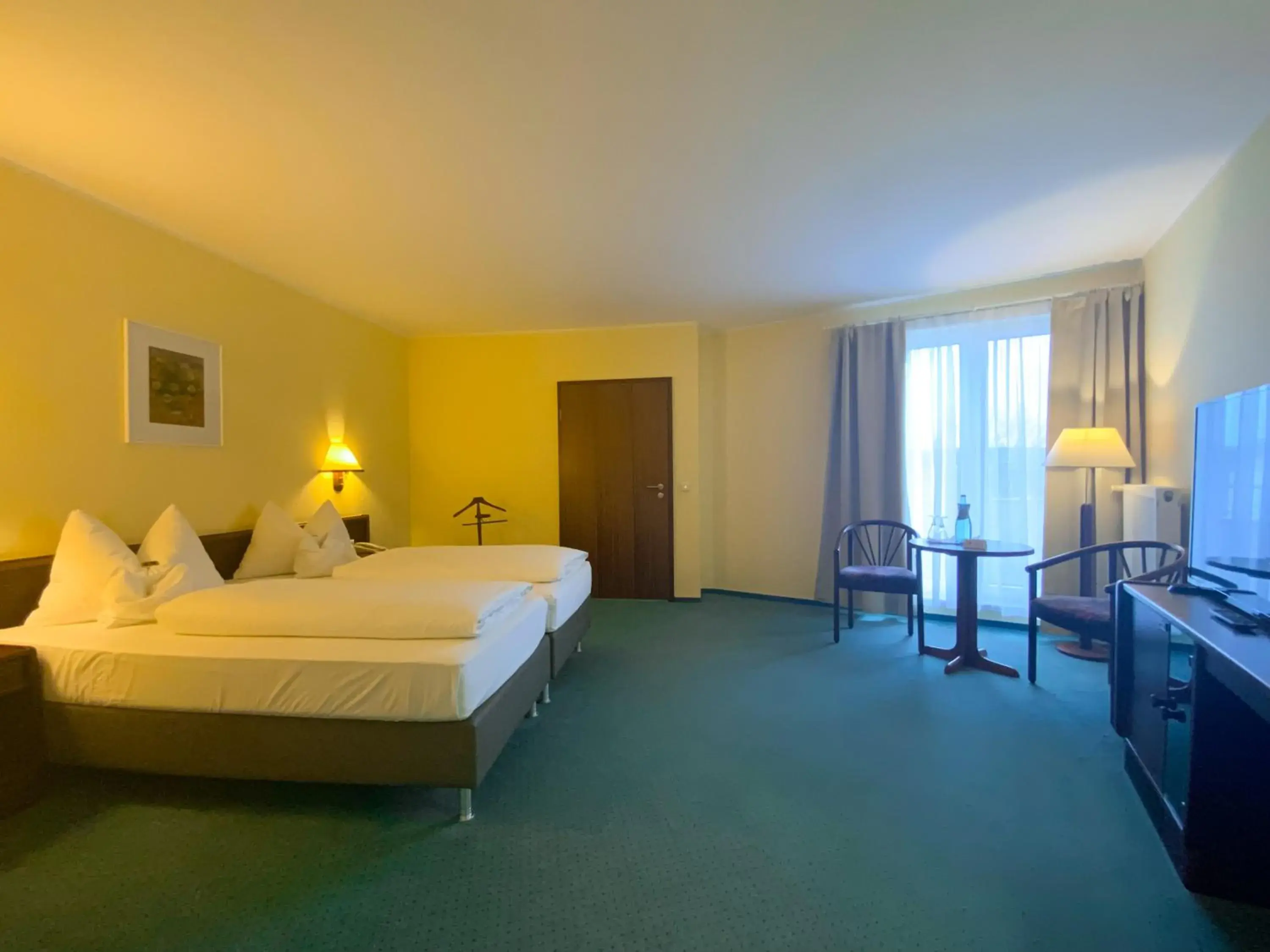 Bed in Heidehotel Lubast Bed in Heidehotel Lubast