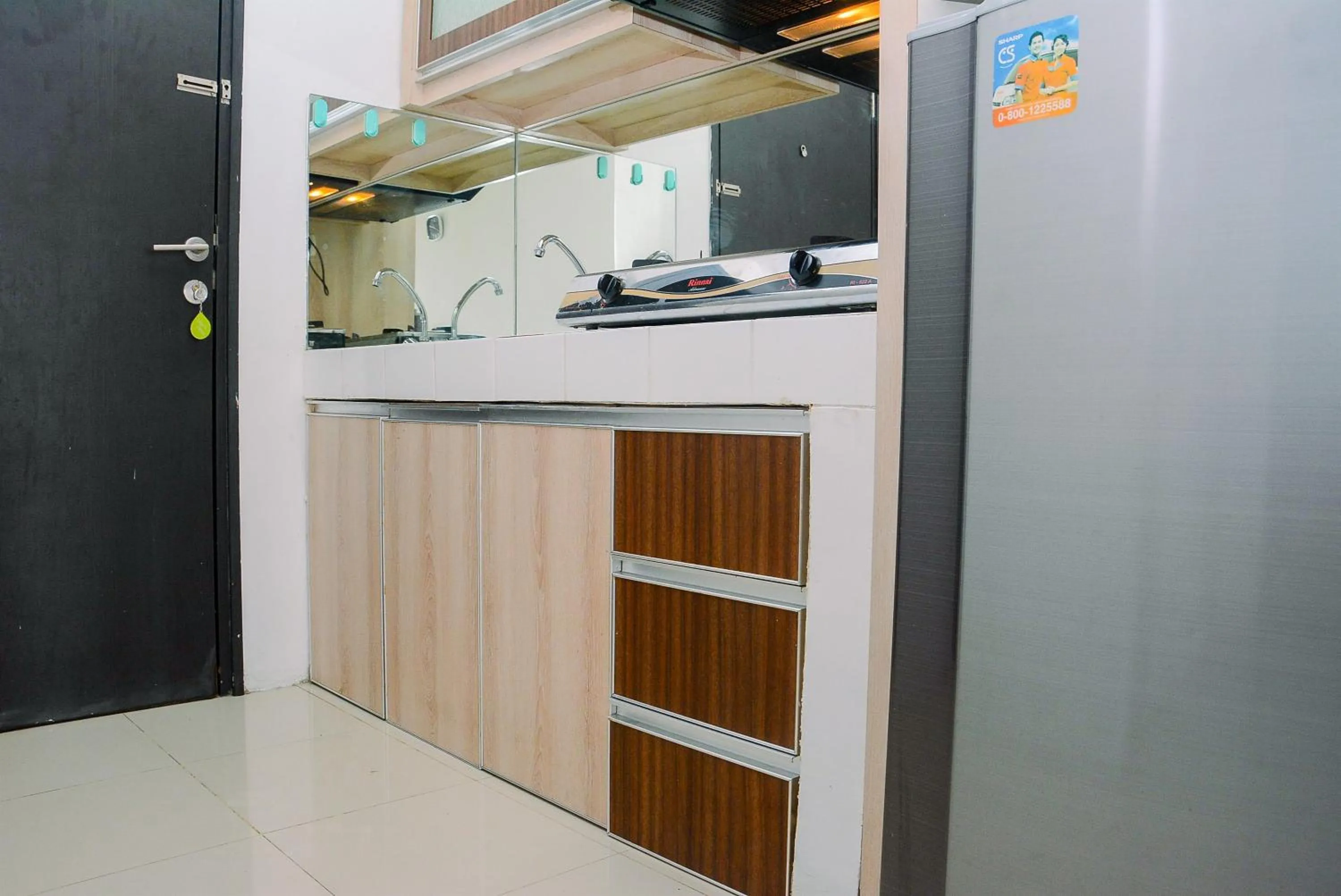Kitchen or kitchenette in 2BR Apartment at Park View Condominium near Universitas Indonesia By Travelio