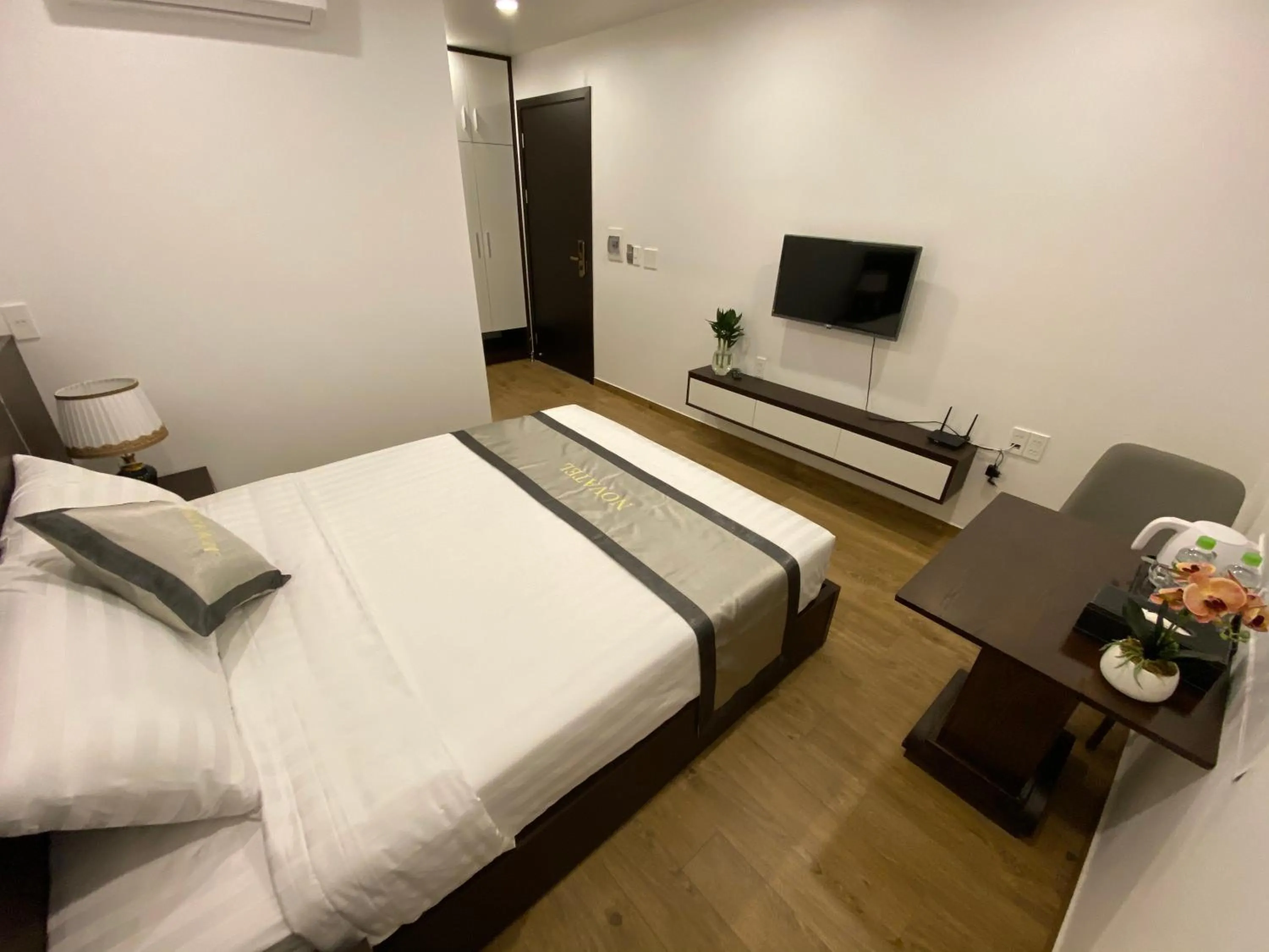 Bed in The Nova Hotel & Apartment