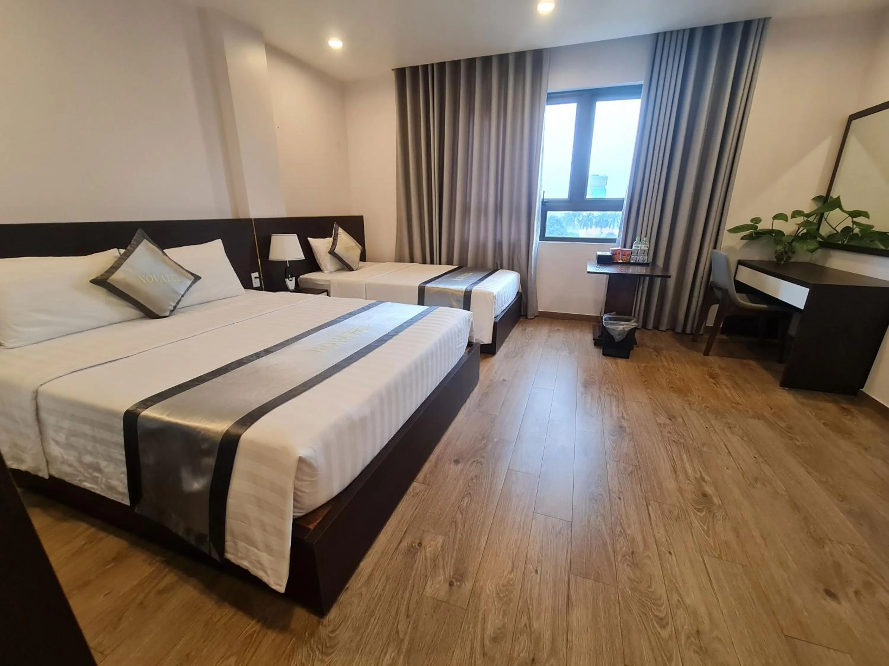 Bed in The Nova Hotel & Apartment