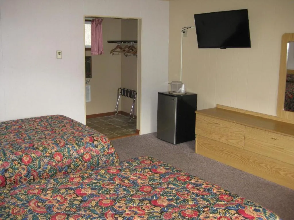 Bed in Brookside Motel & Cabins