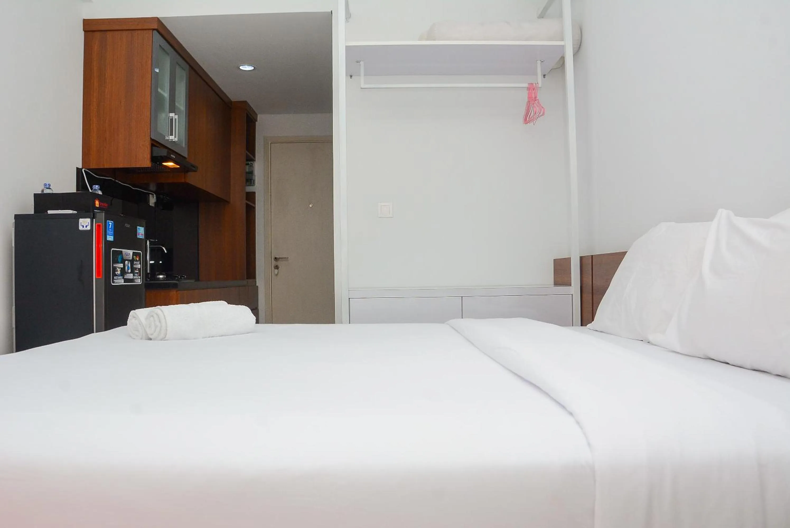 Bed in Comfy Studio Room at Patraland Urbano Apartment By Travelio