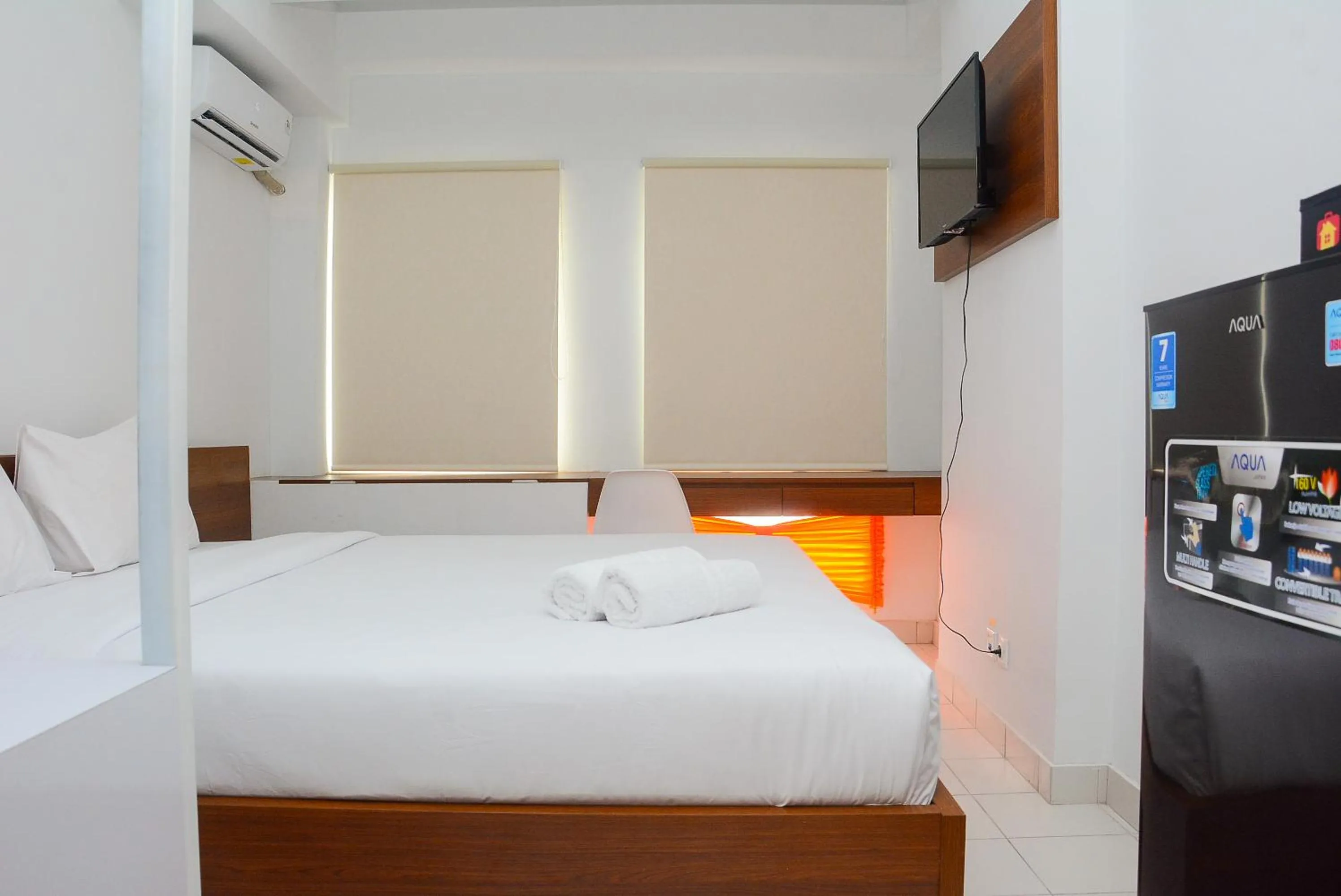 Bed in Comfy Studio Room at Patraland Urbano Apartment By Travelio