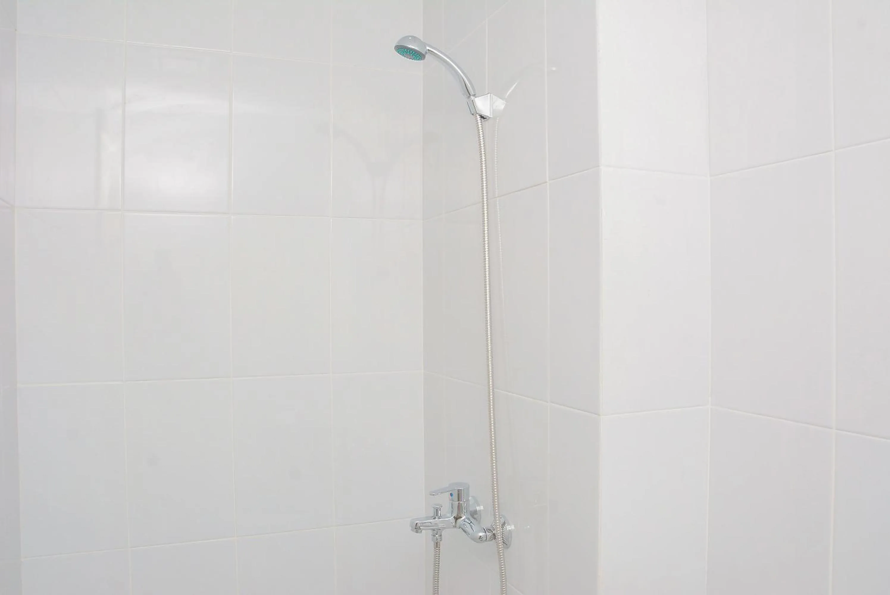 Bathroom in Comfy Studio Room at Patraland Urbano Apartment By Travelio