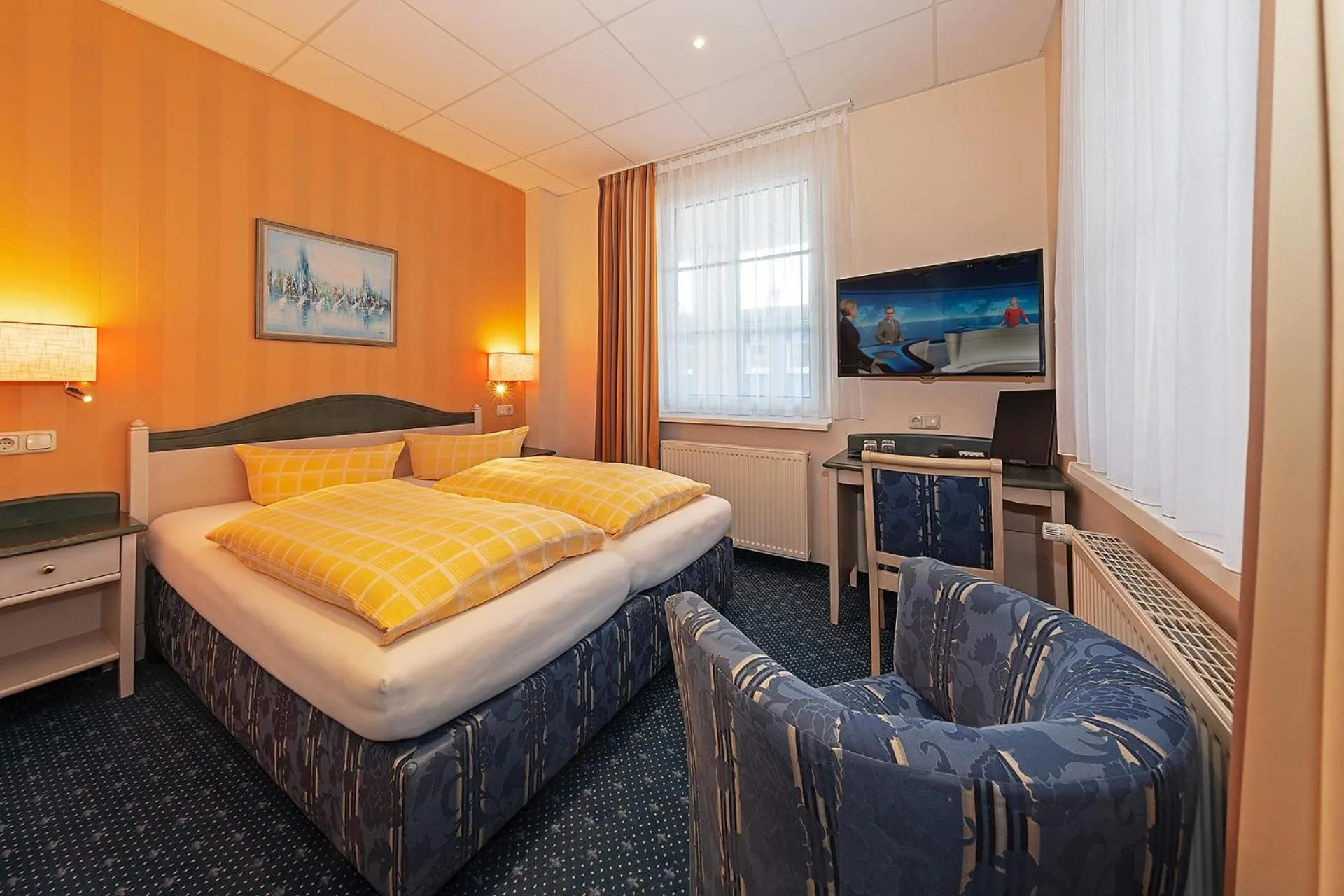 Seating area, Bed in Dünenhotel am Meer