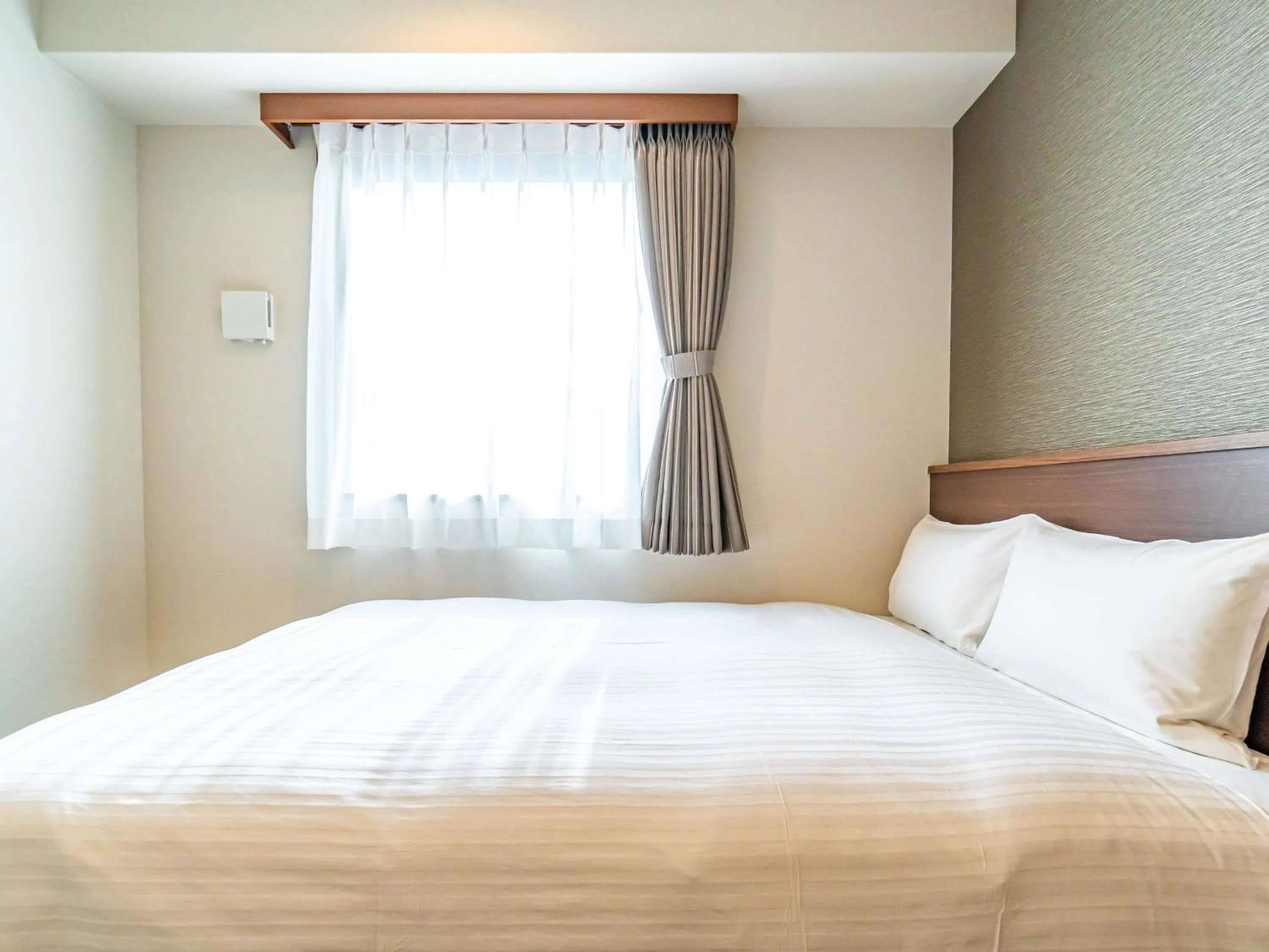 Bed in Bande Hotel Tenpozan Higashi