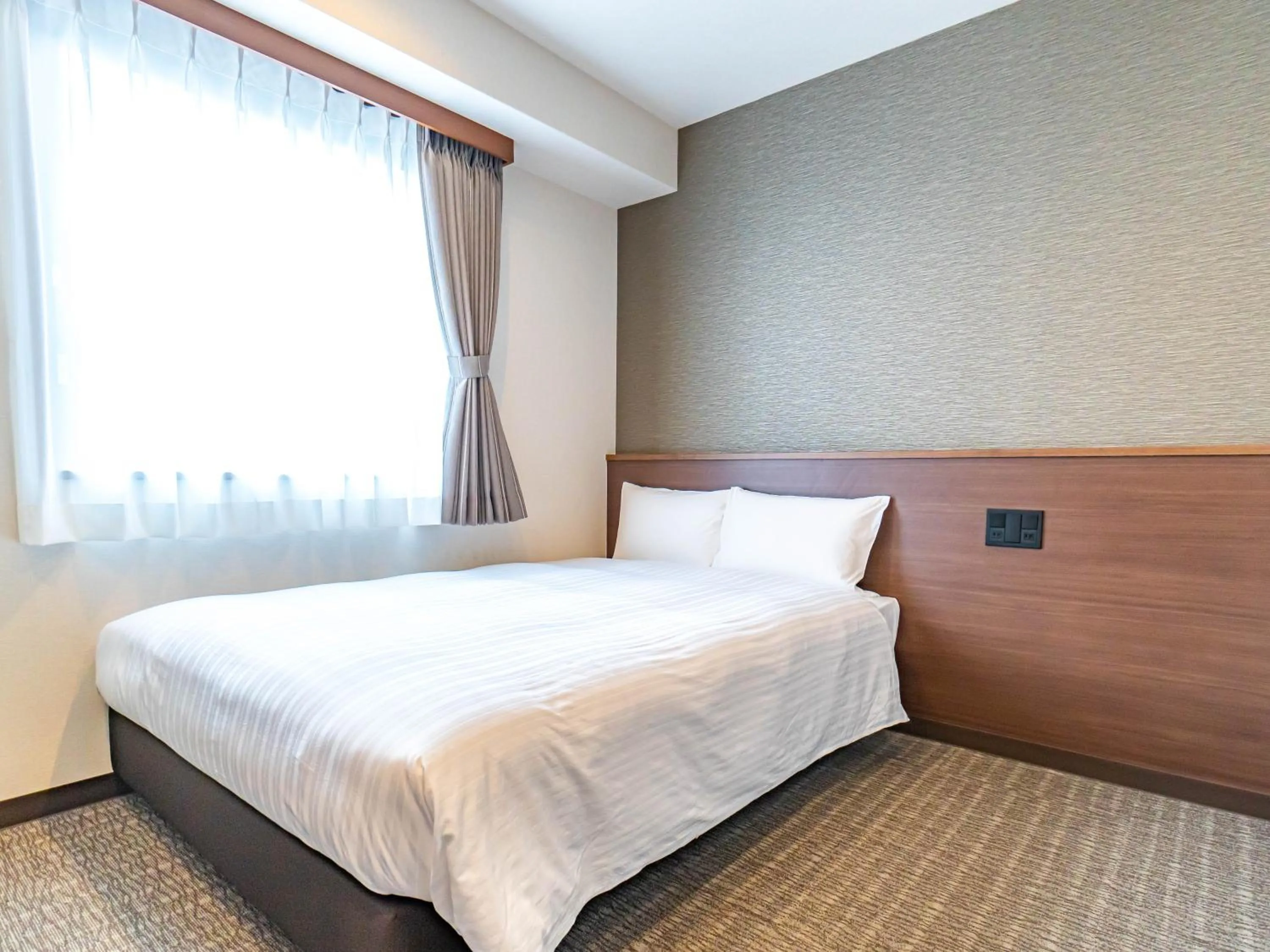 Bed in Bande Hotel Tenpozan Higashi