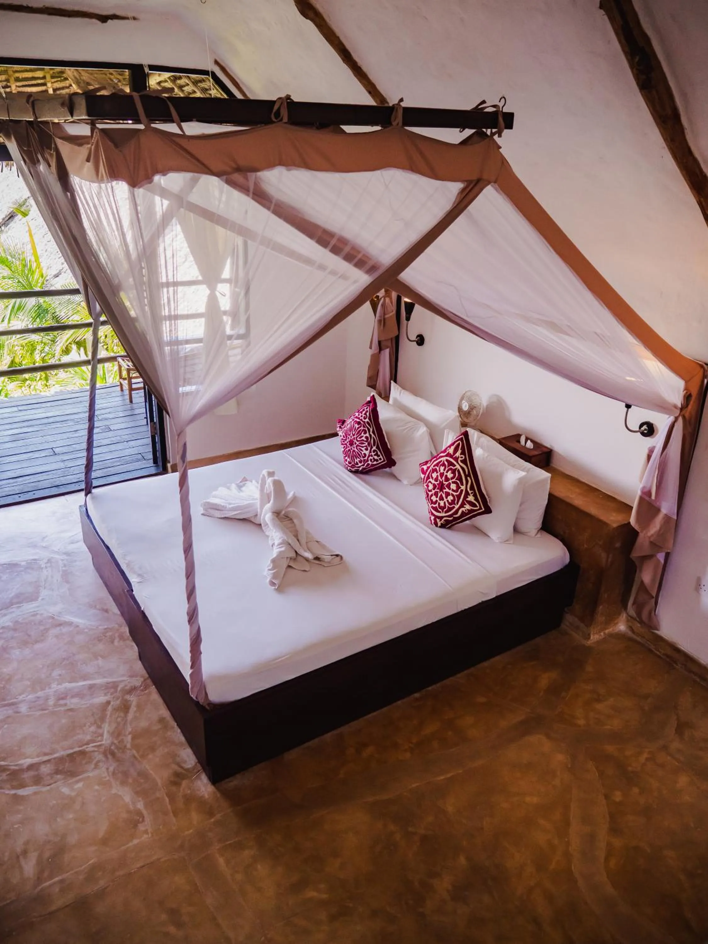 Bed in Sunshine Bay Hotel Zanzibar