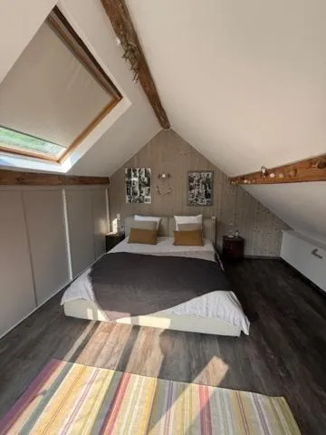 Bed in Le Jardin Des Secrets "Gites et chambres à louer"