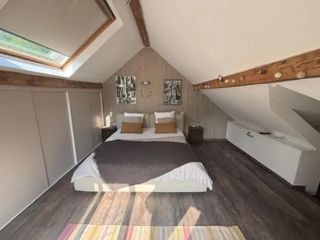 Bed in Le Jardin Des Secrets "Gites et chambres à louer"