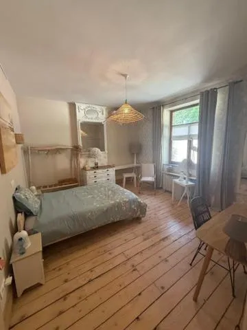 Bed in Le Jardin Des Secrets "Gites et chambres à louer"