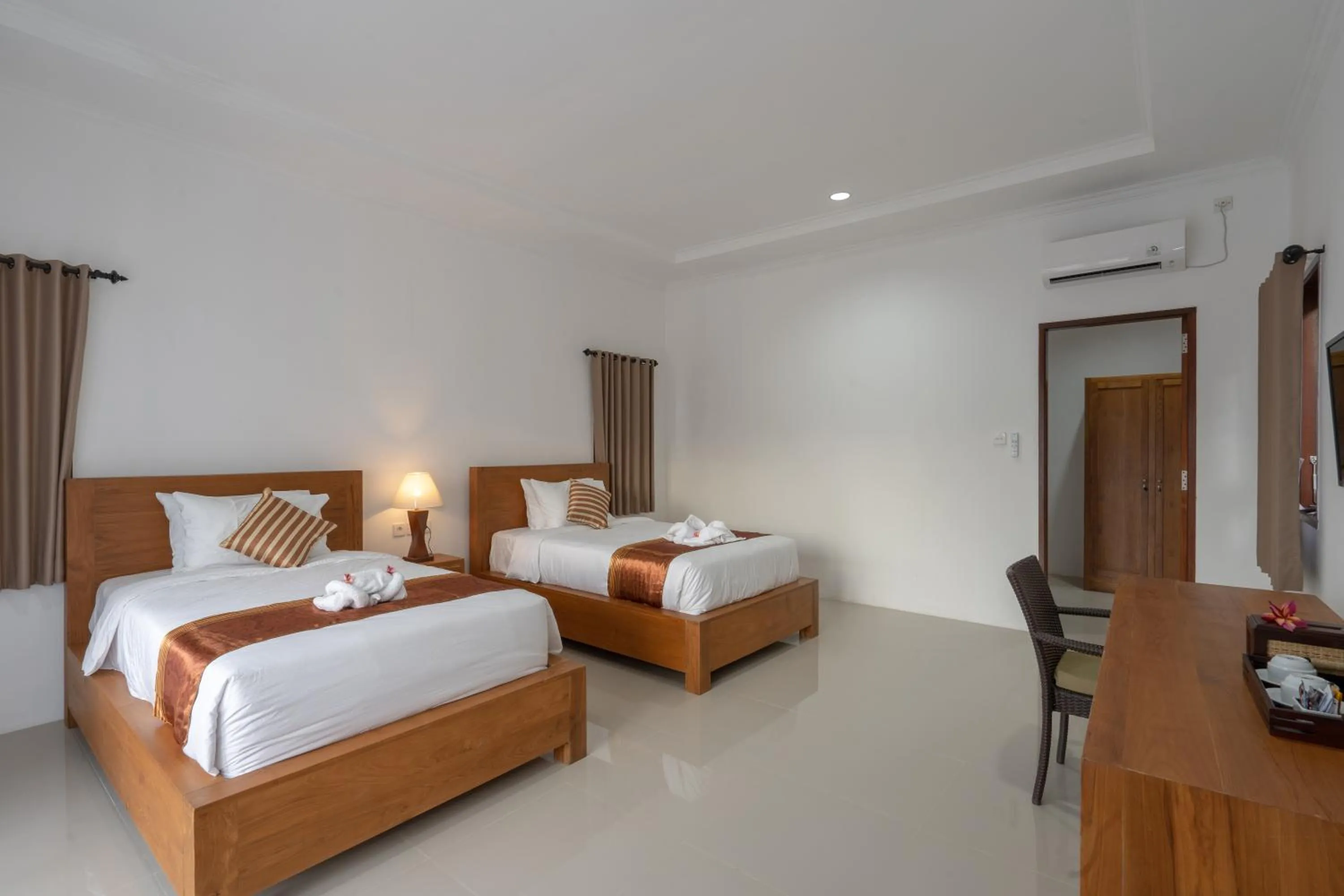 Bed in Nusa Indah Onai Hotel