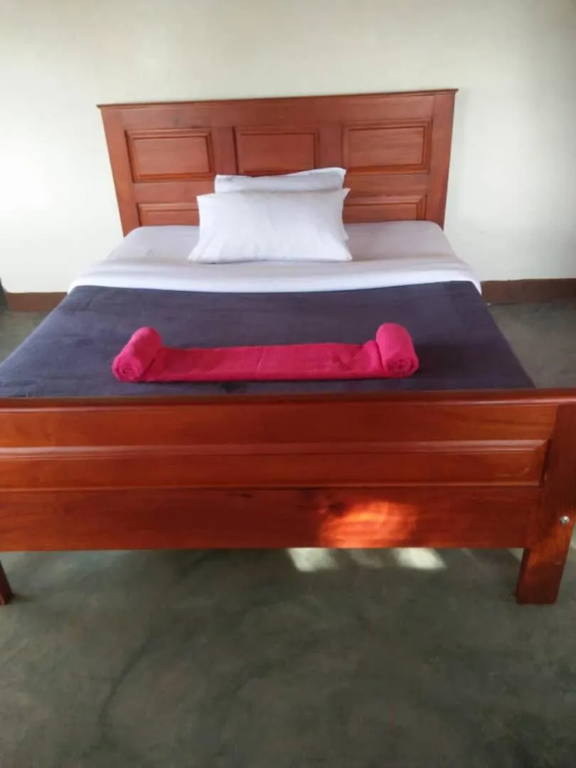 Bed in Tangi Safari Lodge