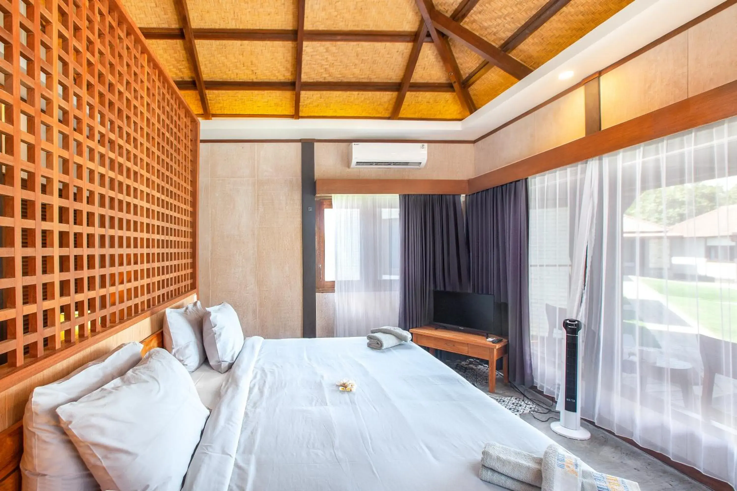 Bed in Hi Blue Bali Melasti Dive Resort Bed in Hi Blue Bali Melasti Dive Resort