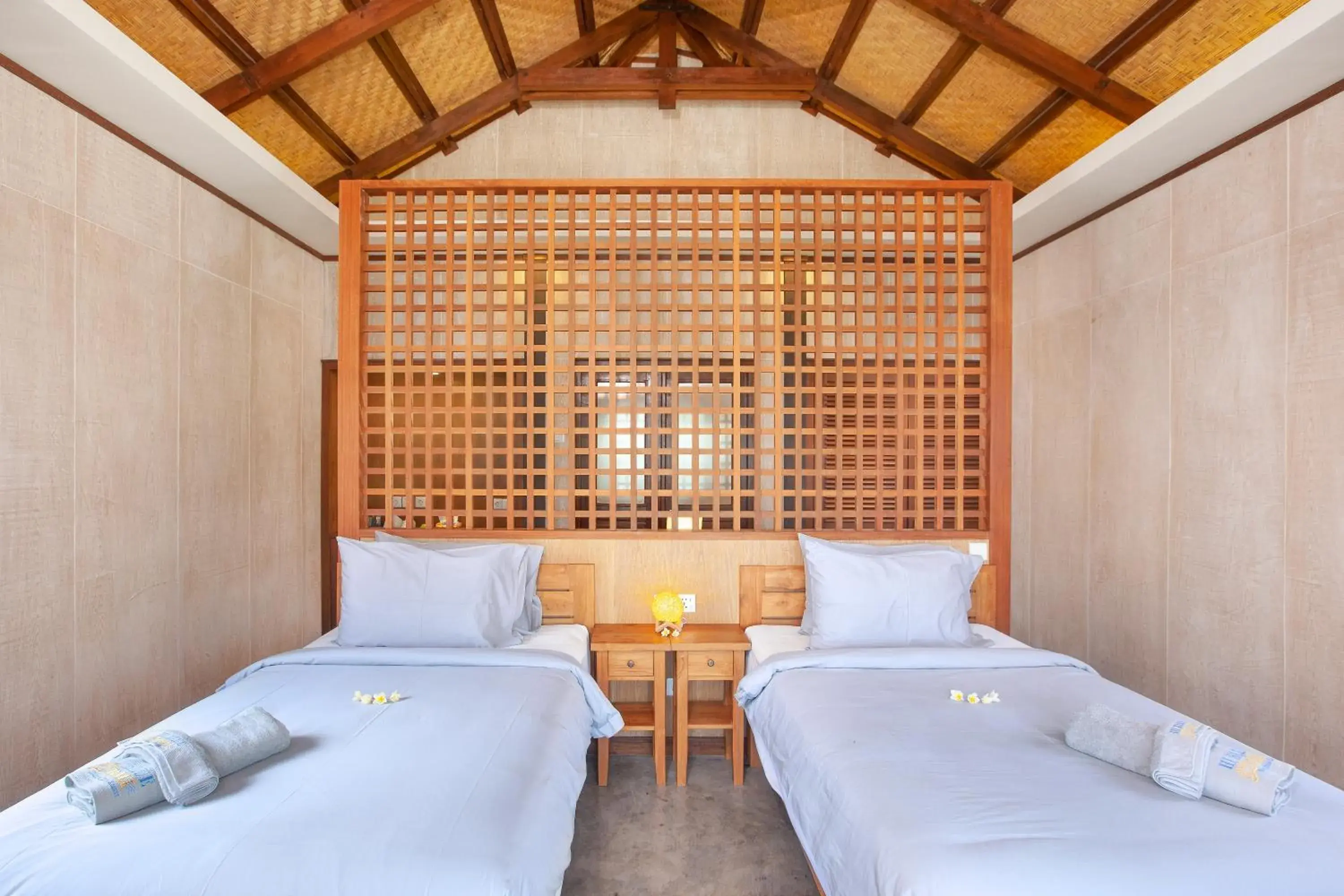 Bed in Hi Blue Bali Melasti Dive Resort Bed in Hi Blue Bali Melasti Dive Resort