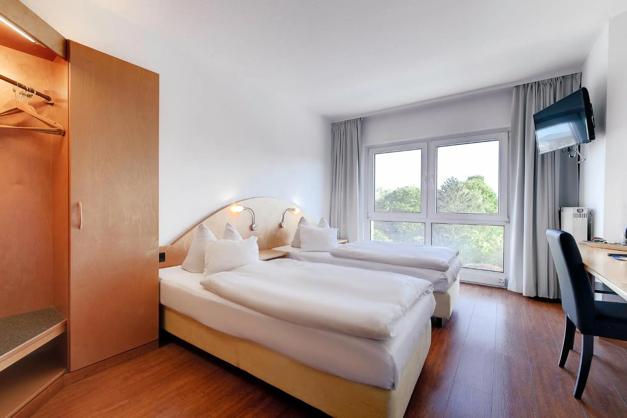 Guests, Bed in Ambiente Langenhagen Hannover by Tulip Inn