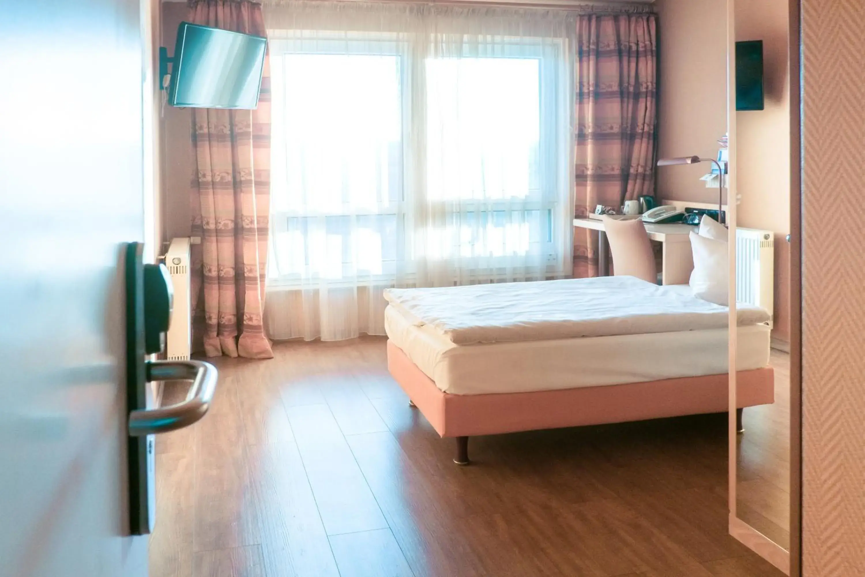 Photo of the whole room, Bed in Ambiente Langenhagen Hannover by Tulip Inn Photo of the whole room, Bed in Ambiente Langenhagen Hannover by Tulip Inn