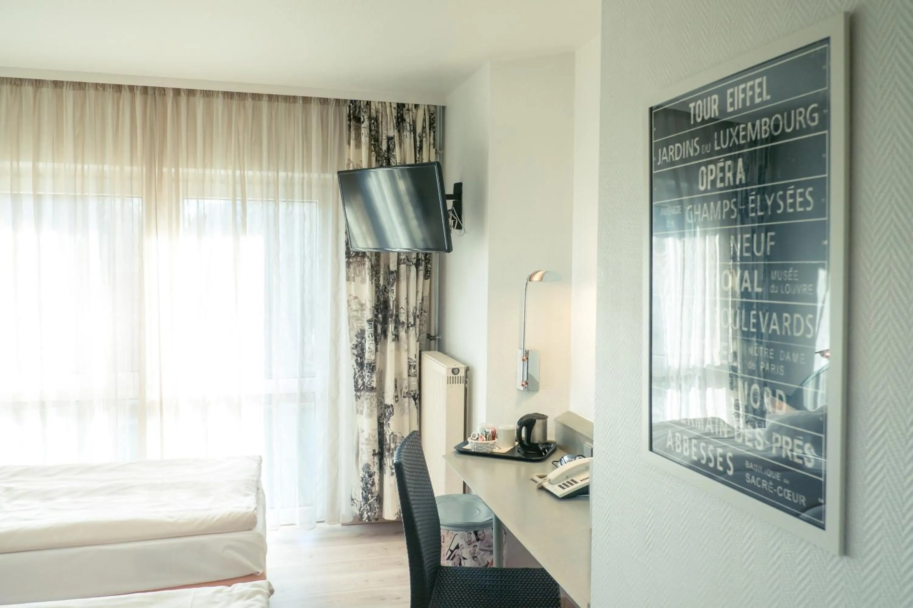 Bedroom, Bed in Ambiente Langenhagen Hannover by Tulip Inn