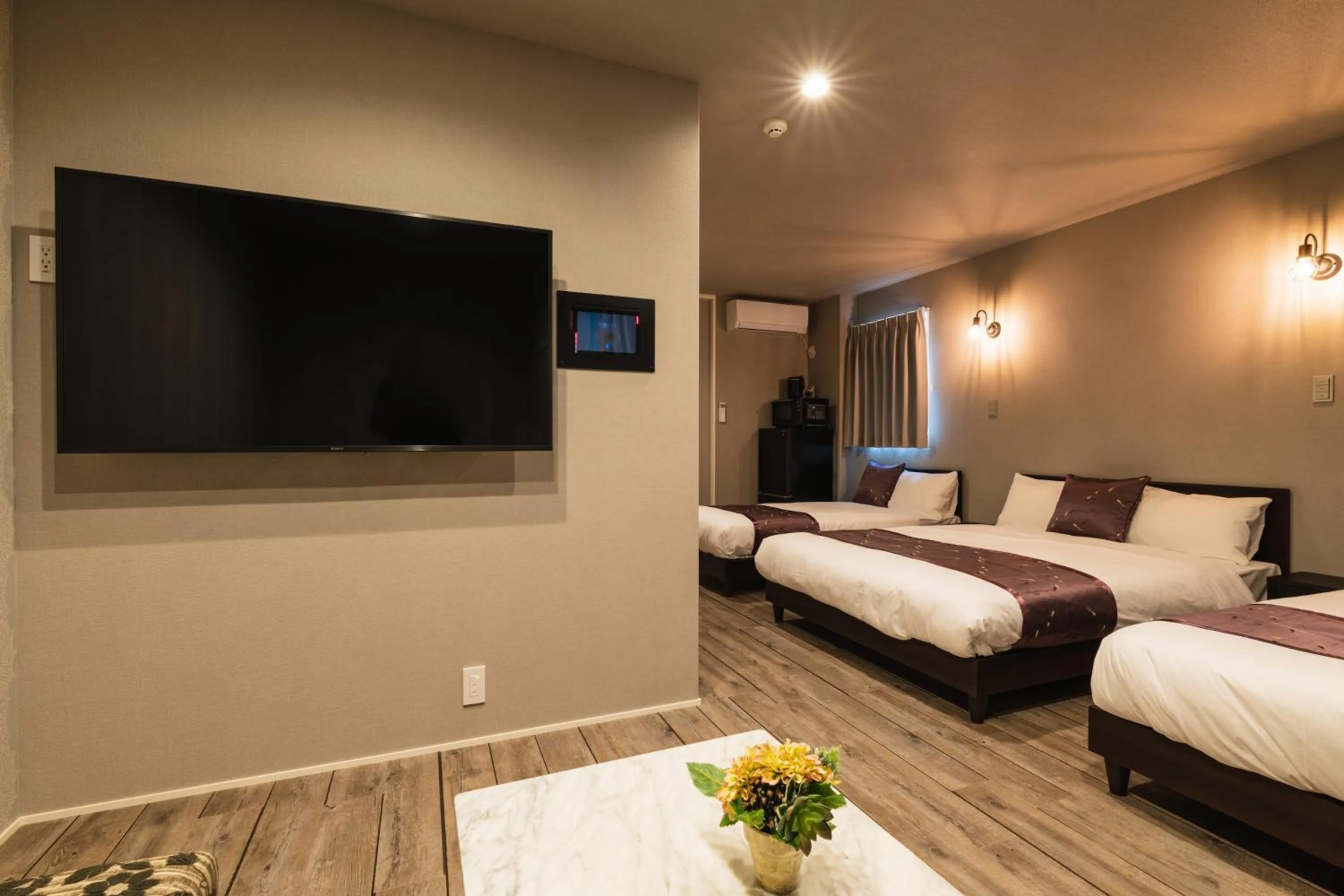 Photo of the whole room, Bed in GRAND BASE Nagasaki City