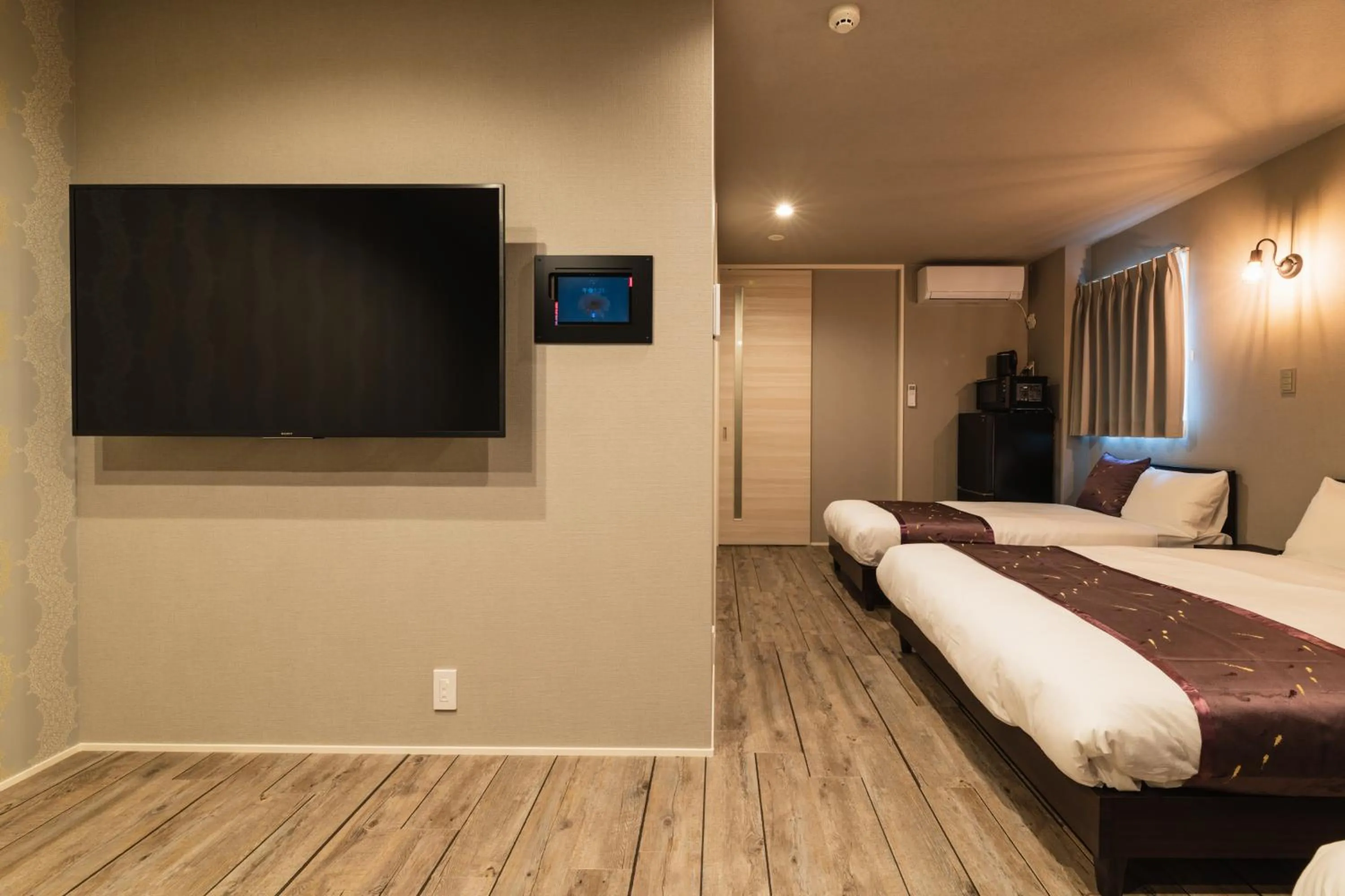 Photo of the whole room, Bed in GRAND BASE Nagasaki City