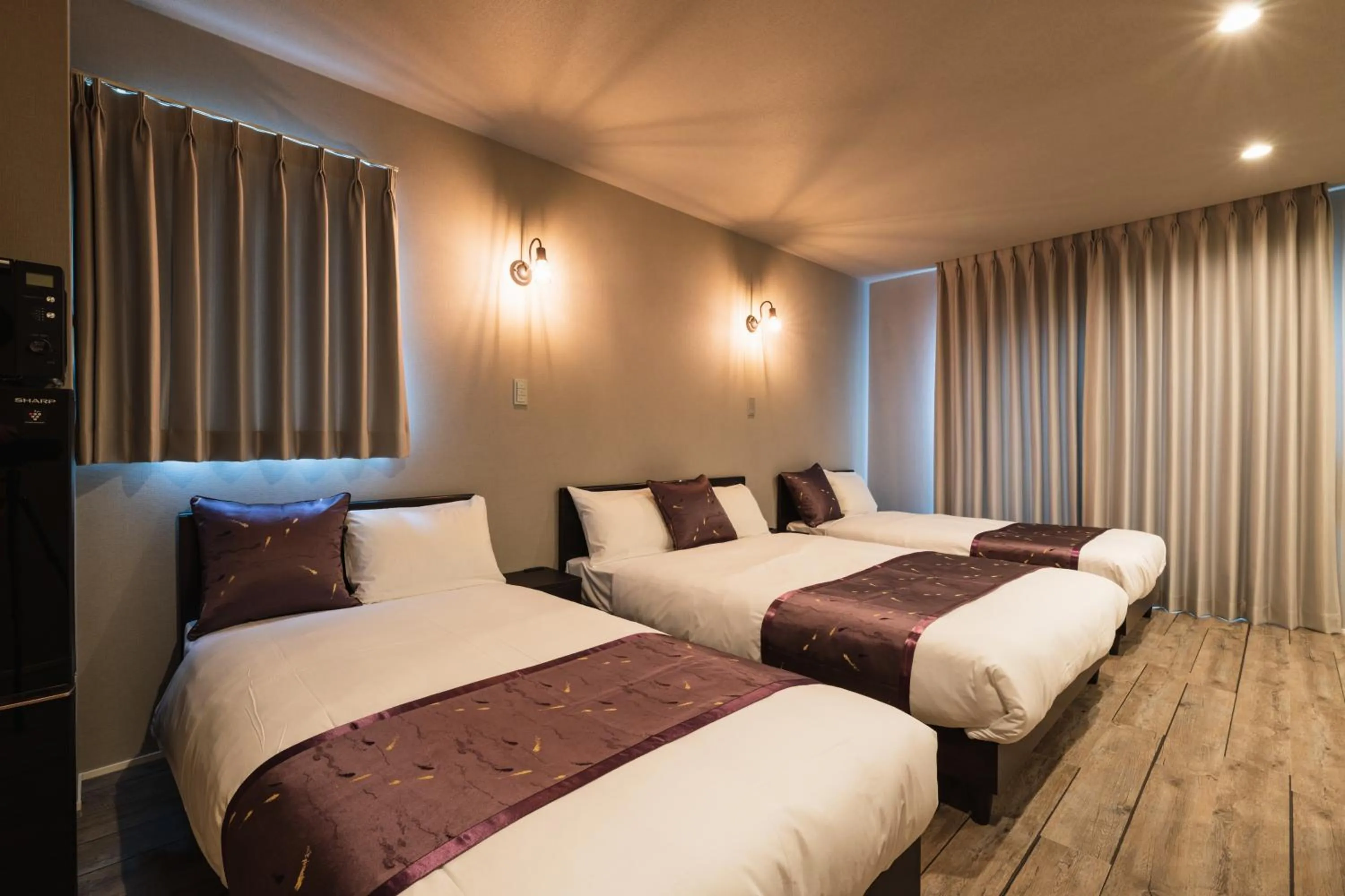 Bed in GRAND BASE Nagasaki City