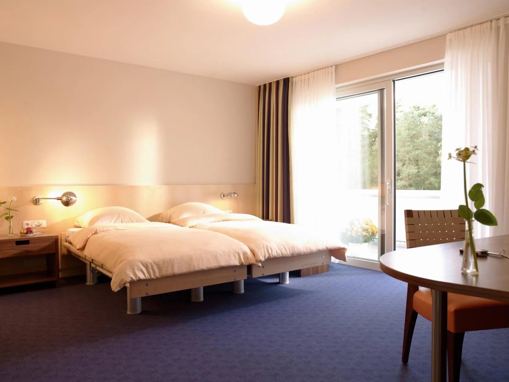 Photo of the whole room, Bed in Heidehotel Bad Bevensen