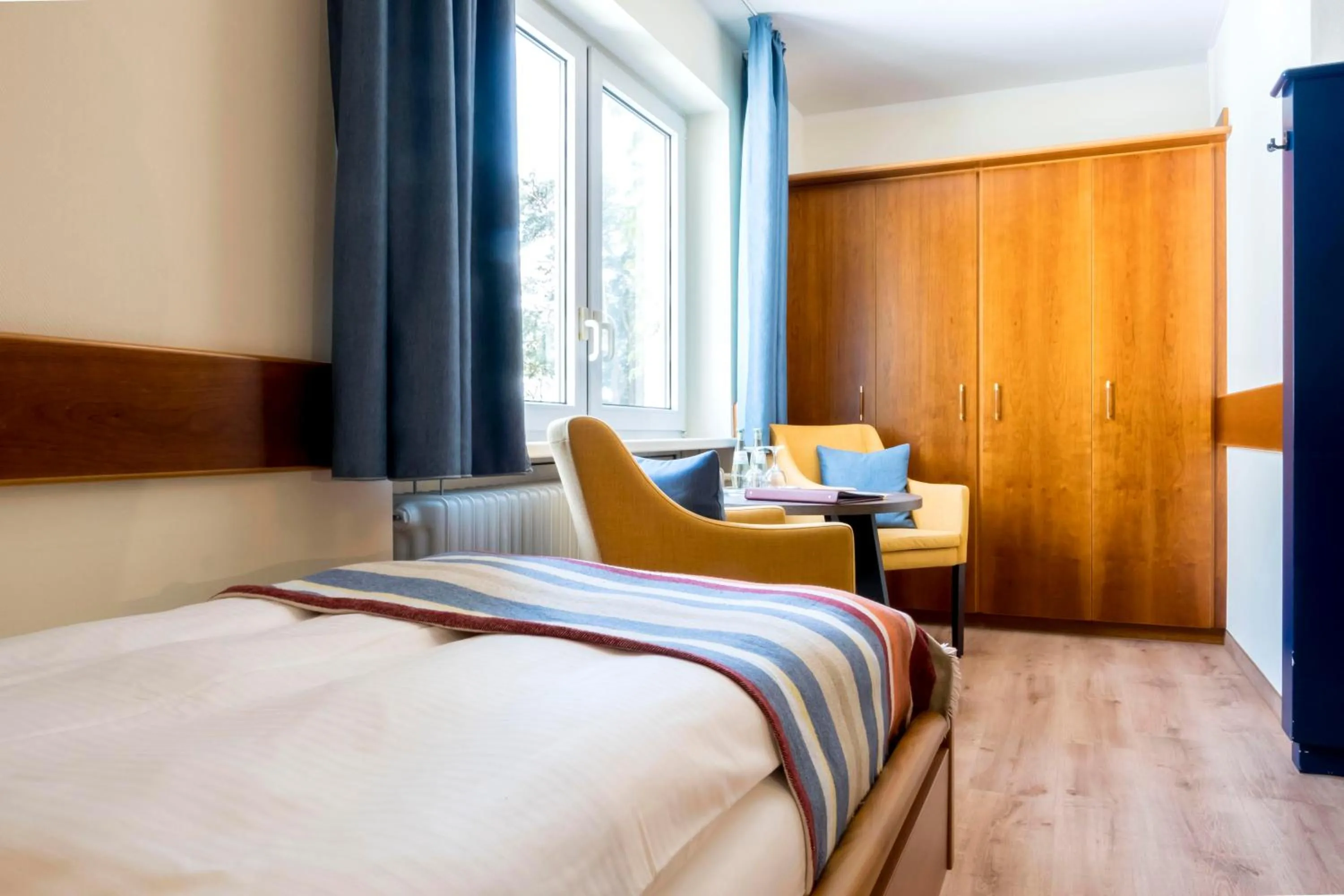 Photo of the whole room, Bed in Heidehotel Bad Bevensen