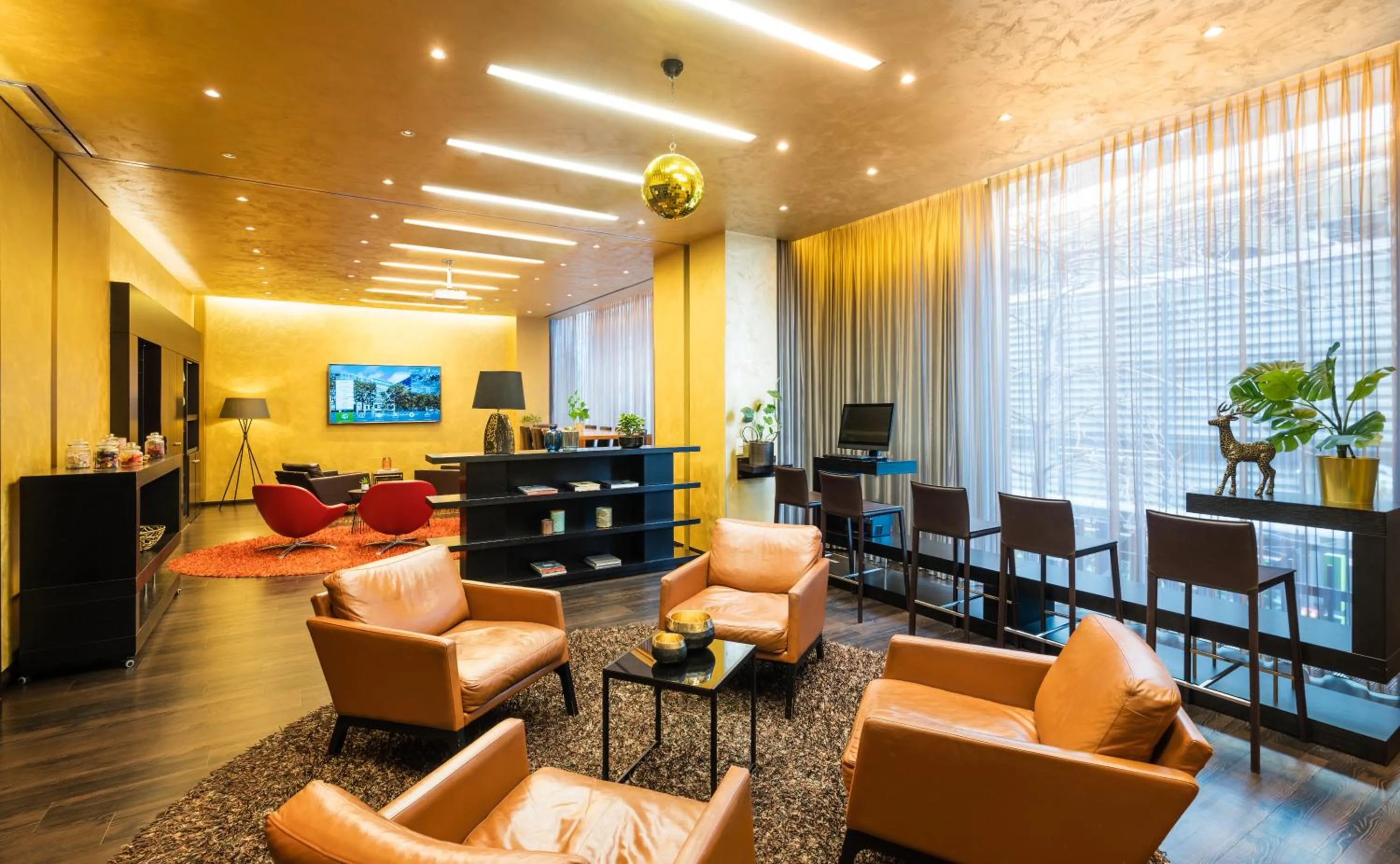Communal lounge/ TV room in Lindner Hotel Berlin Ku'damm, part of JdV by Hyatt