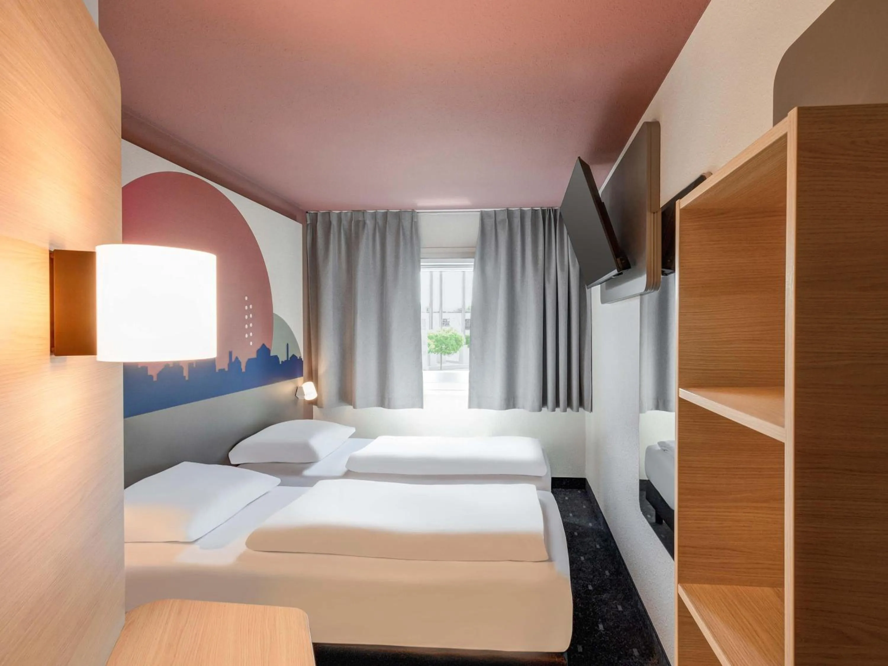 Photo of the whole room, Bed in B&B HOTEL Kassel-Lohfelden