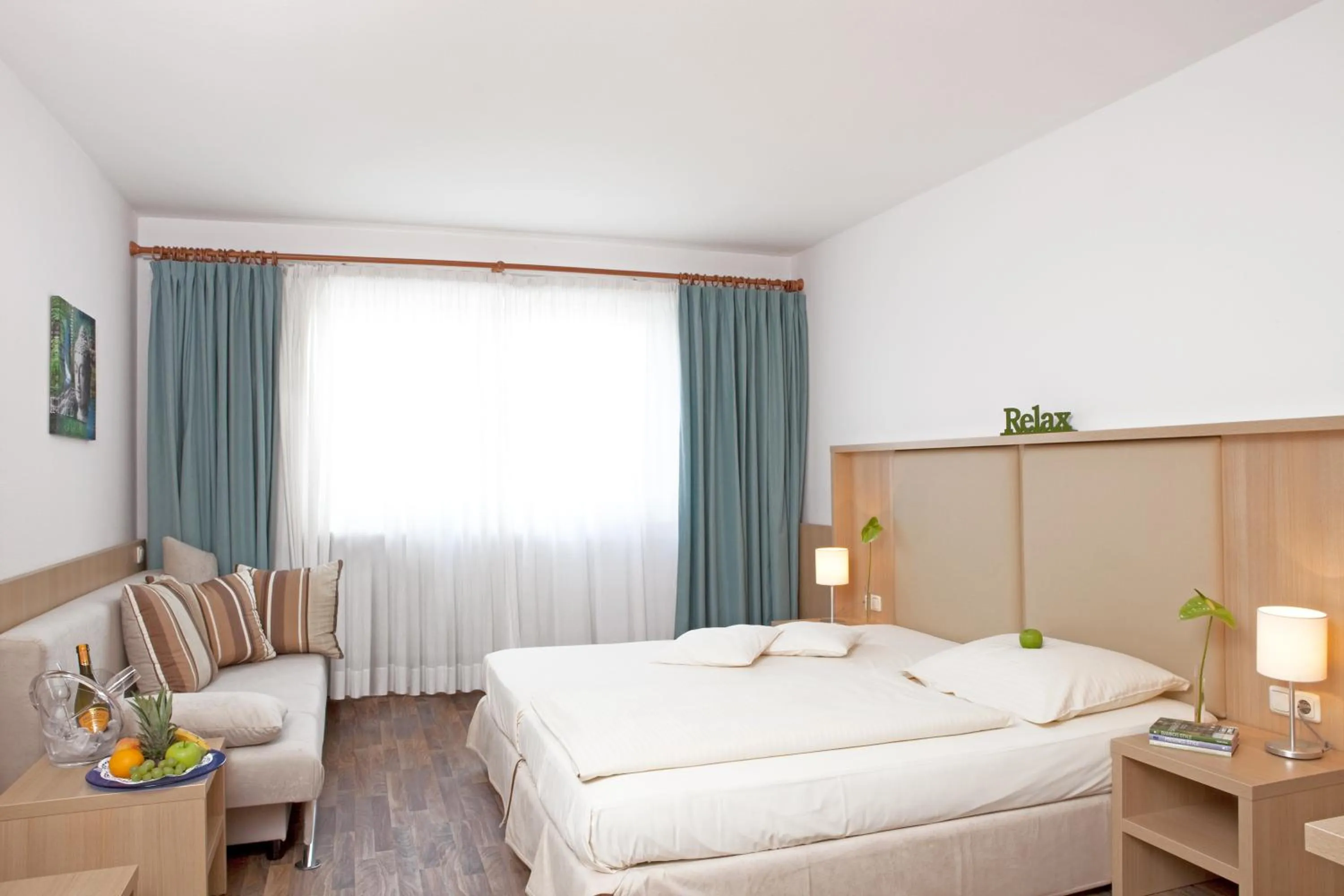 Photo of the whole room, Bed in QU Hotel Augsburg