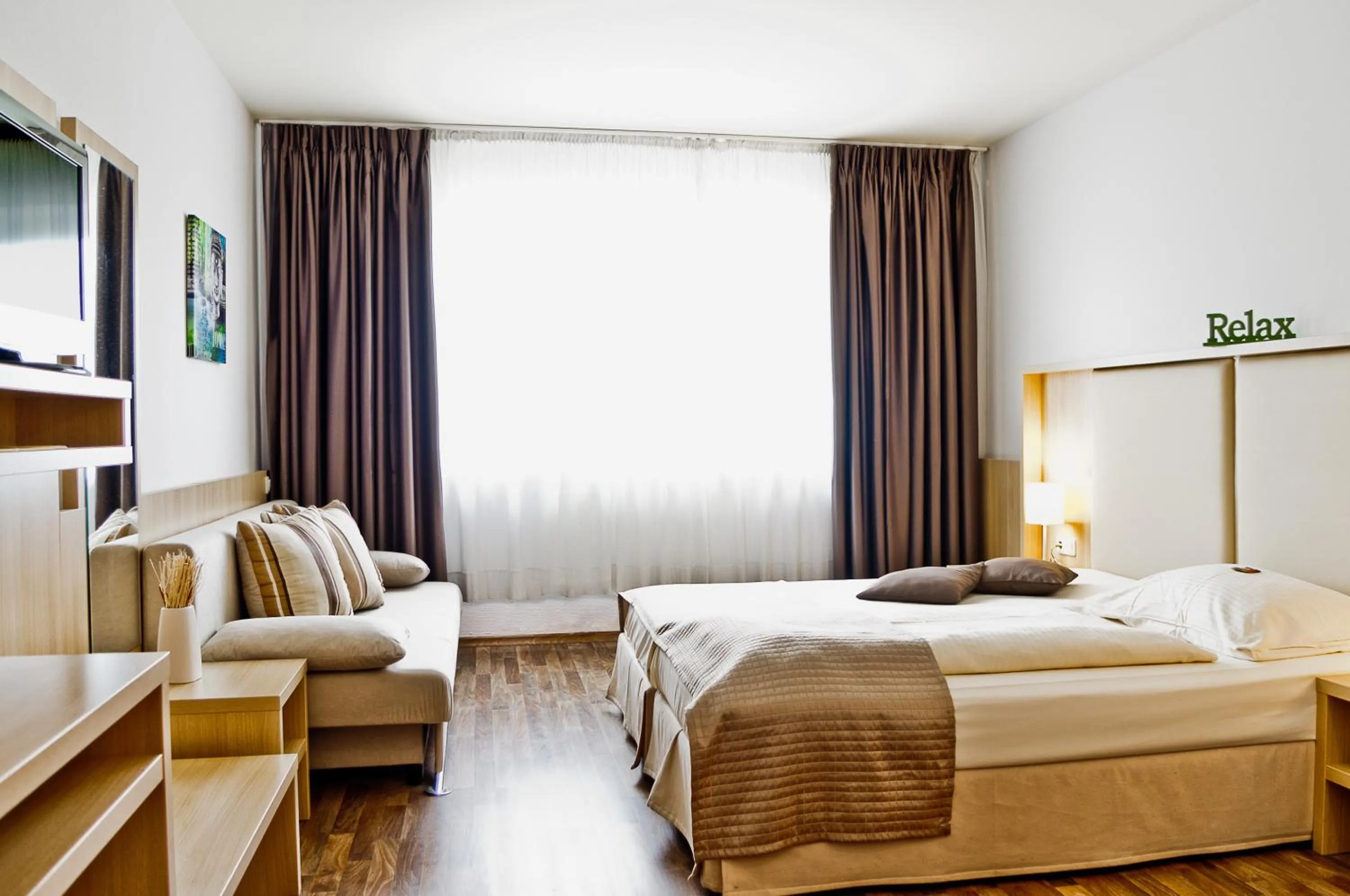 Photo of the whole room, Bed in QU Hotel Augsburg