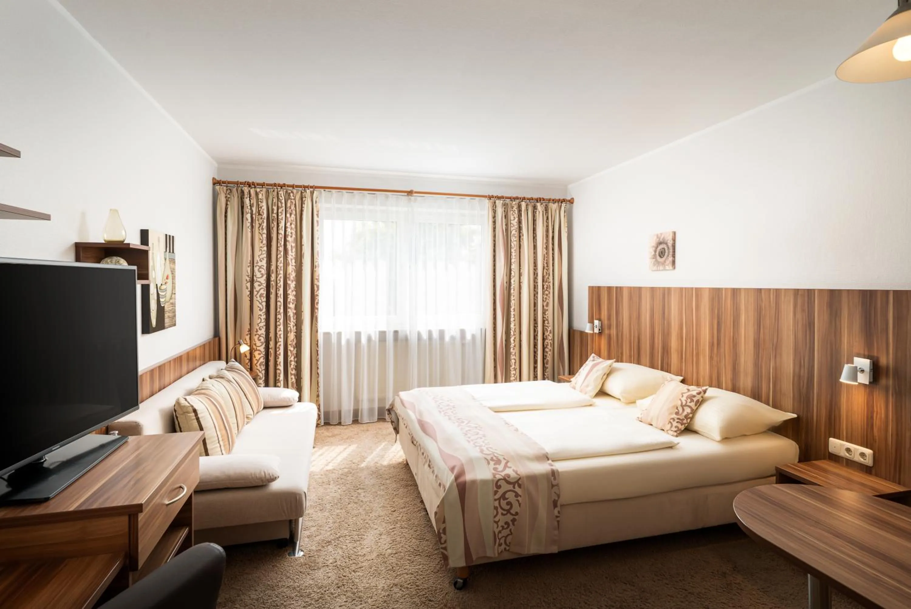 Photo of the whole room, Bed in QU Hotel Augsburg