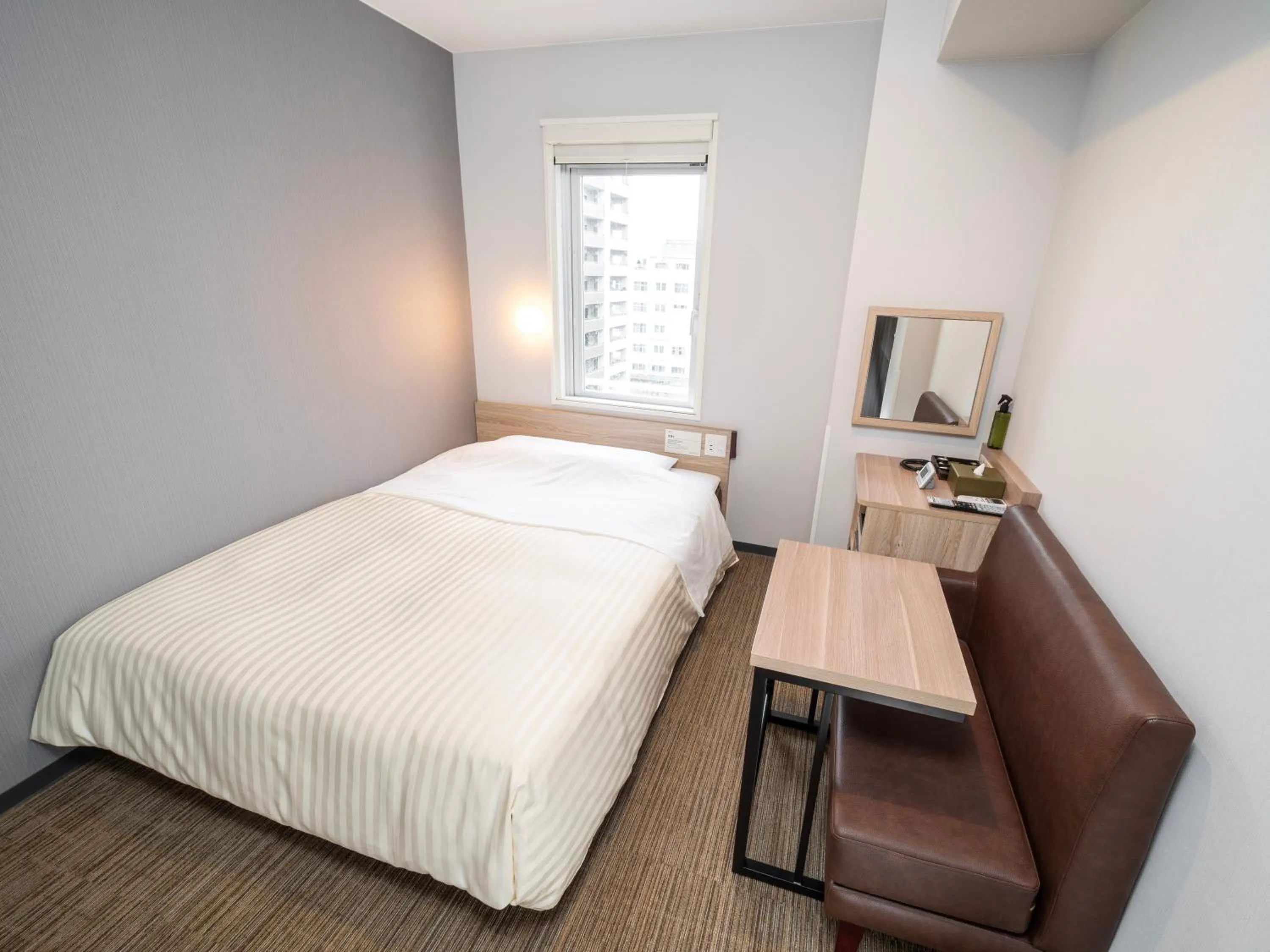 Bed in Super Hotel Okayama Station Higashiguchi