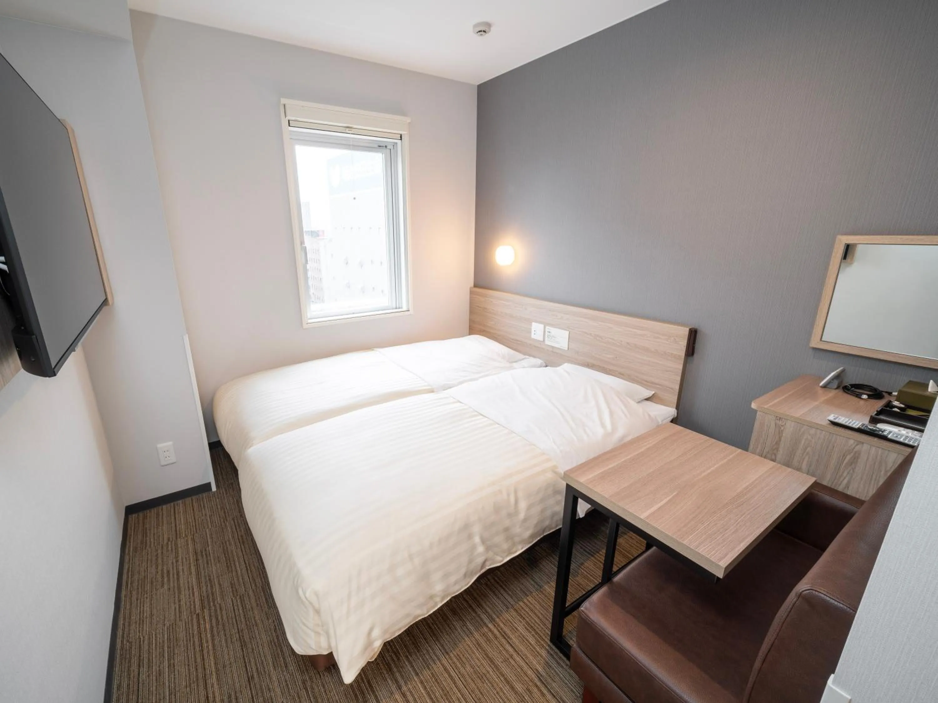 Bed in Super Hotel Okayama Station Higashiguchi