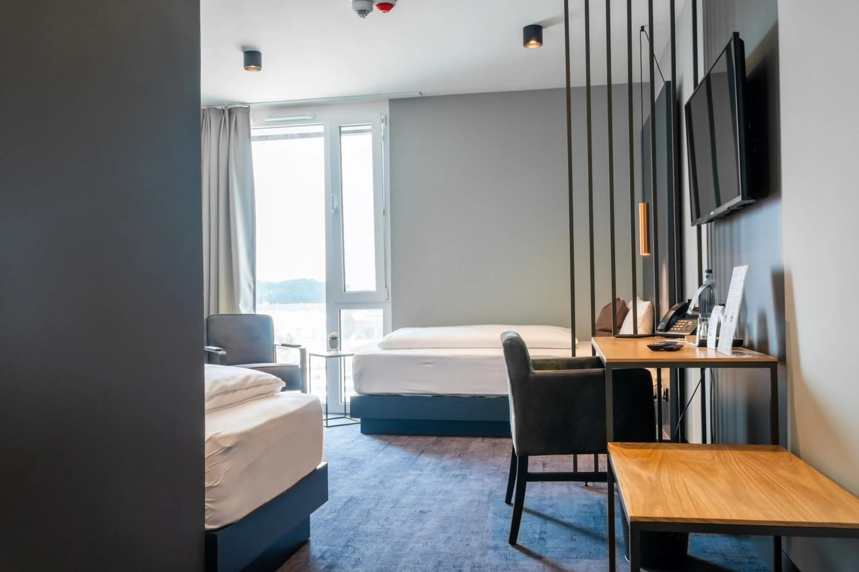 Bed in AKZENT Hotel DÉJANIL