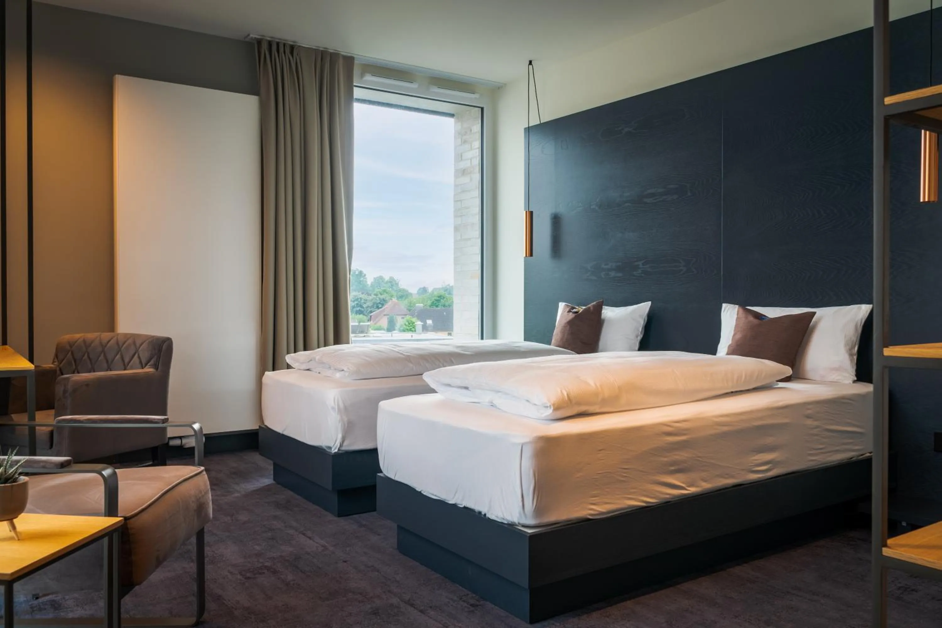 Bed in AKZENT Hotel DÉJANIL