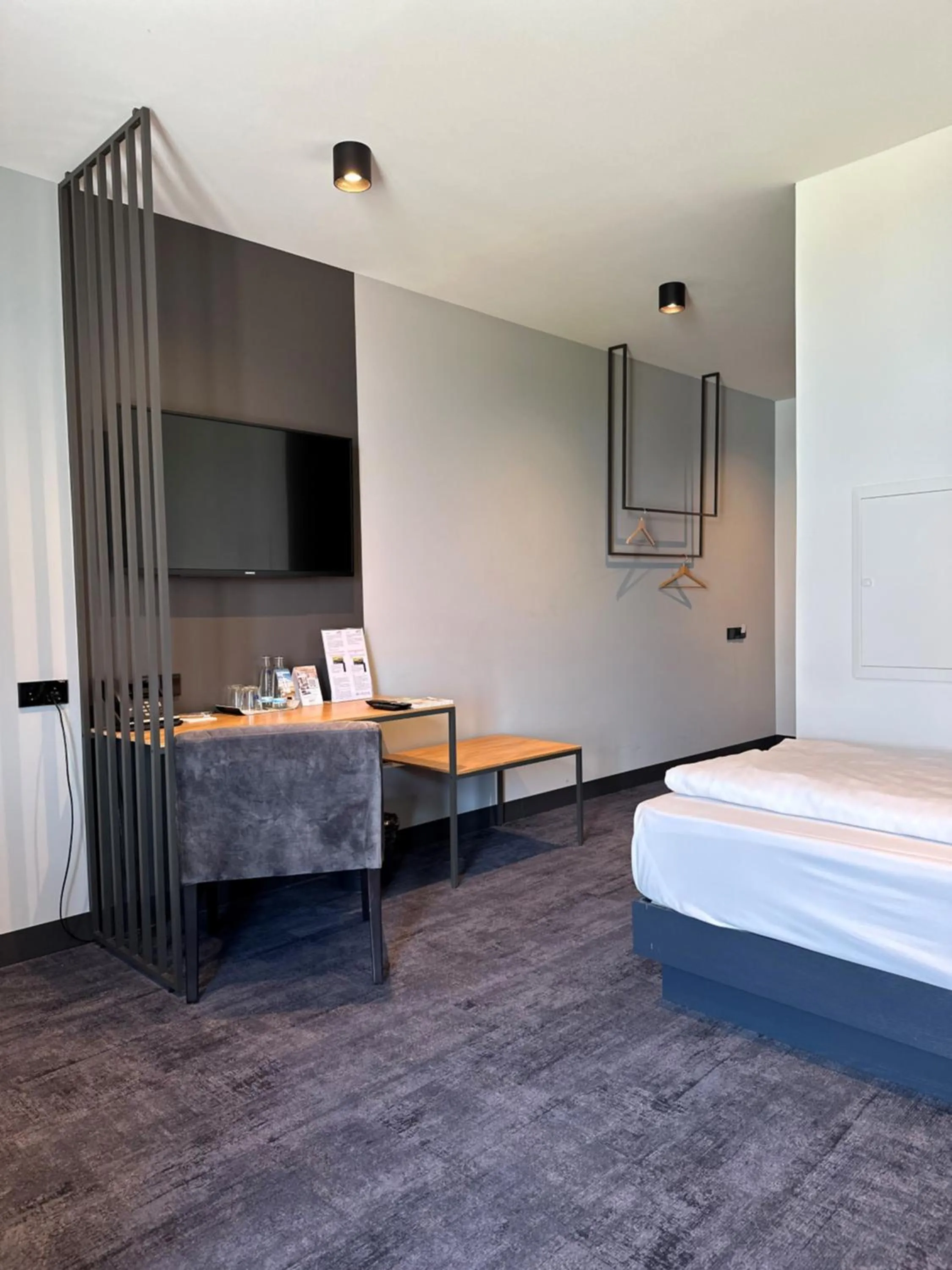 Bed in AKZENT Hotel DÉJANIL