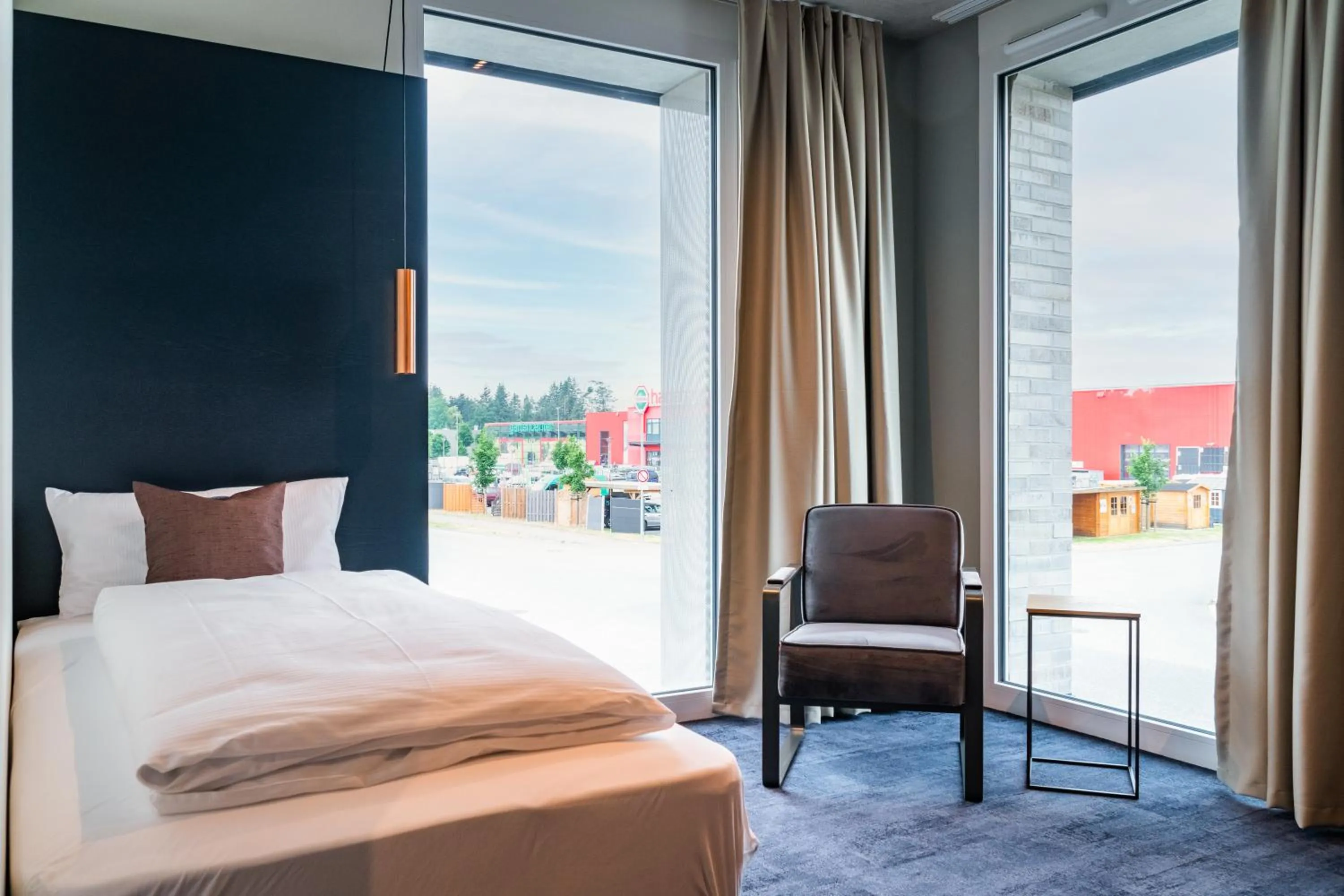 Bed in AKZENT Hotel DÉJANIL