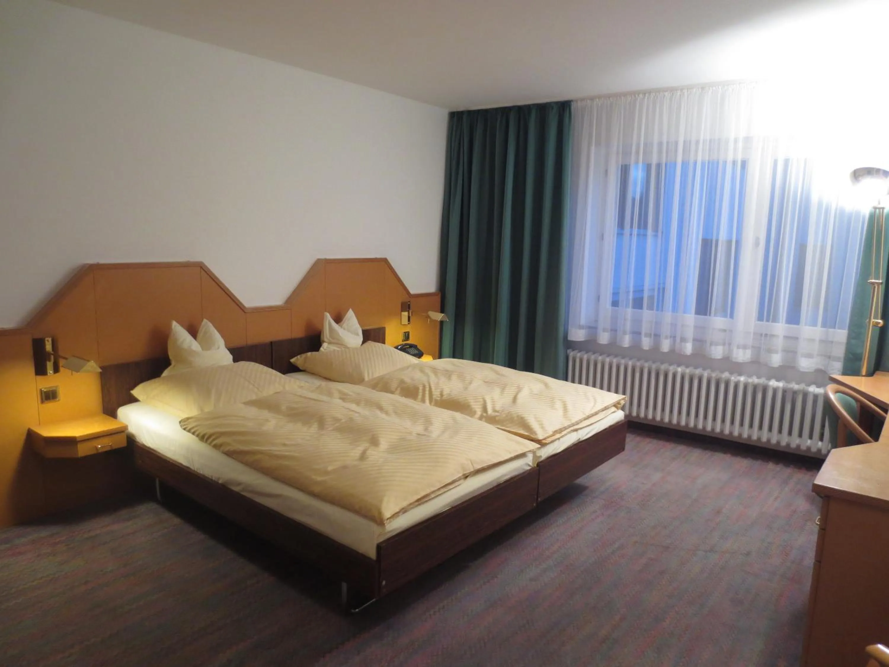 Photo of the whole room, Bed in Parkhotel Goldlinde